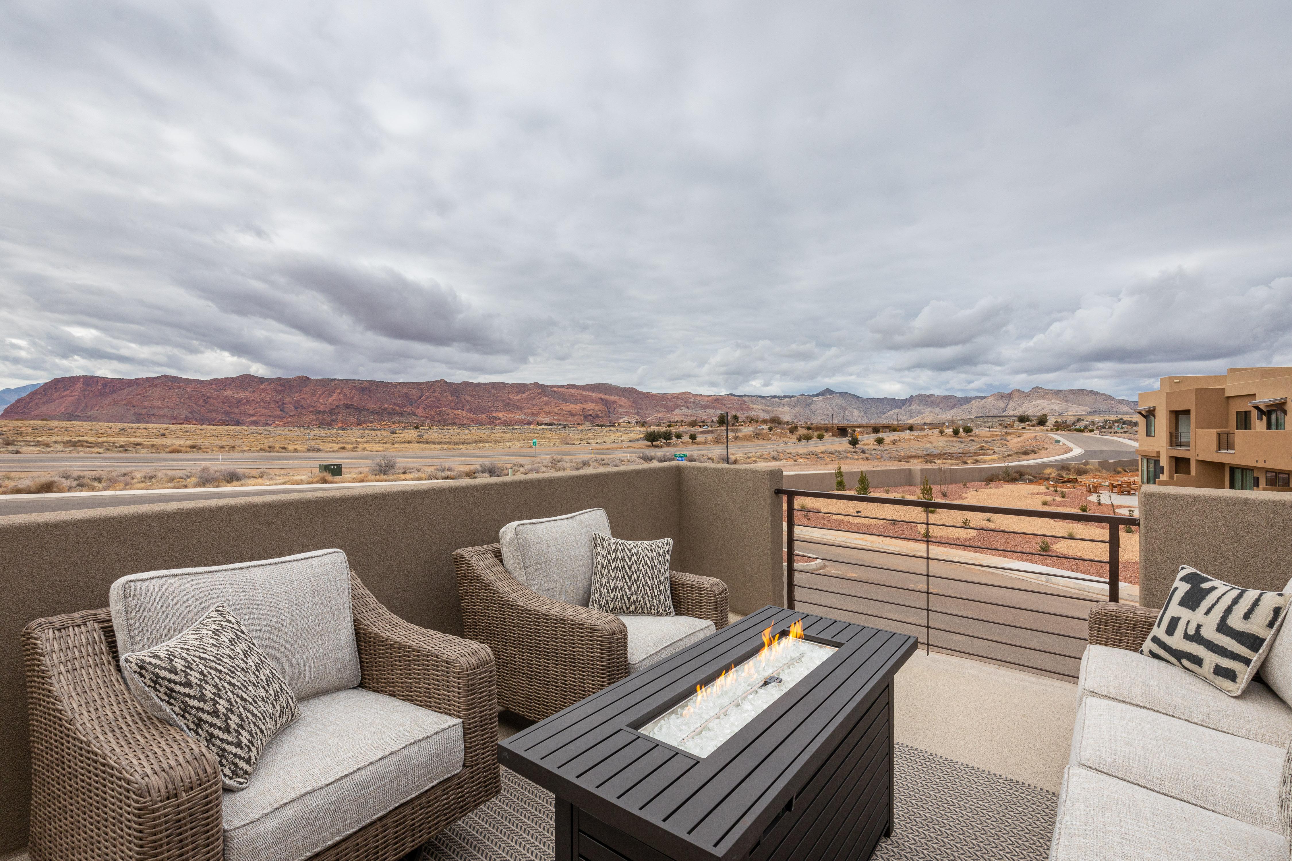 Stay warm next to the fire-pit and relax while watching the sunset over the red mountains.