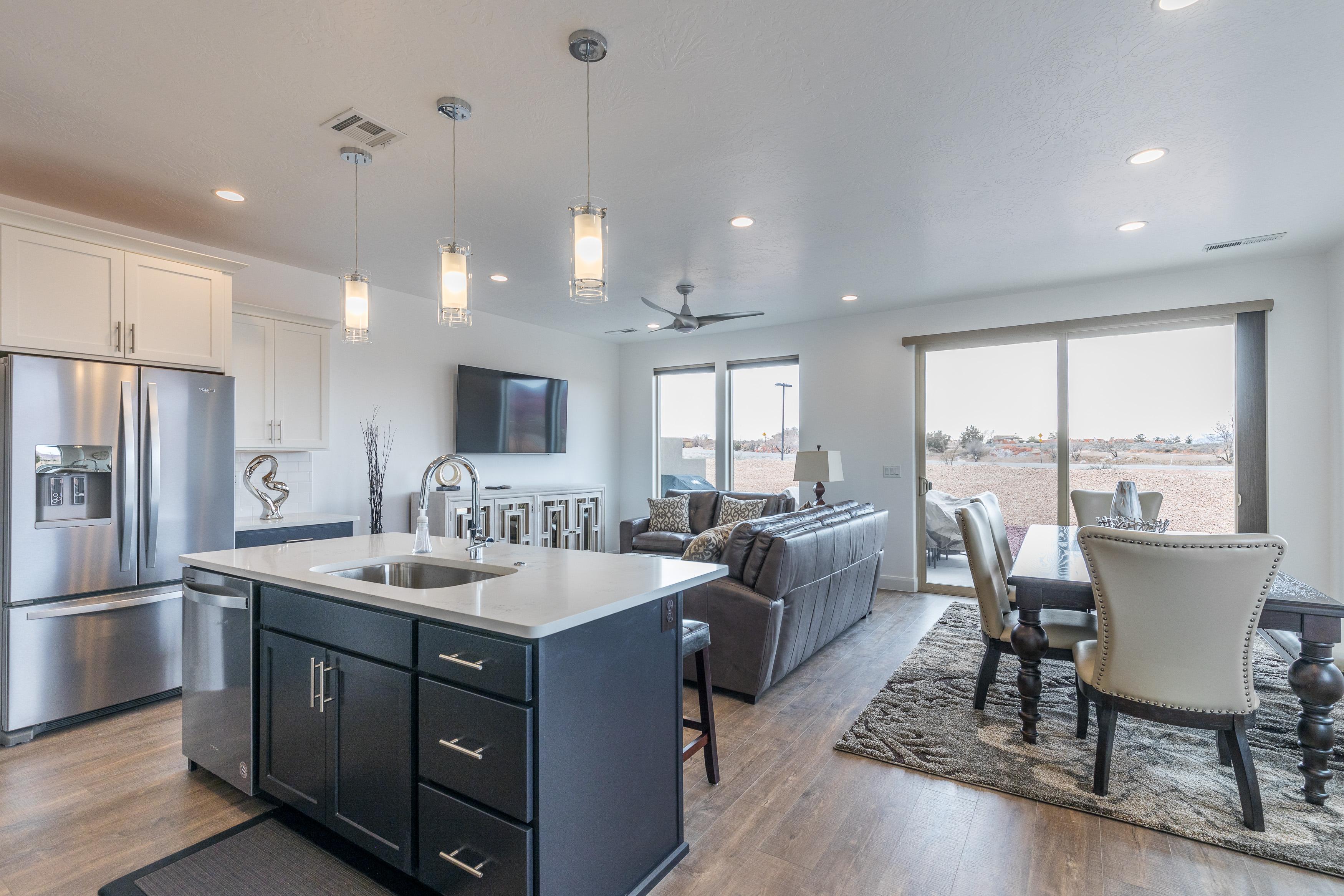 The living room is conveniently adjacent to the kitchen. There is also access to the back patio which has a BBQ grille suitable for all your favorite BBQ dishes.