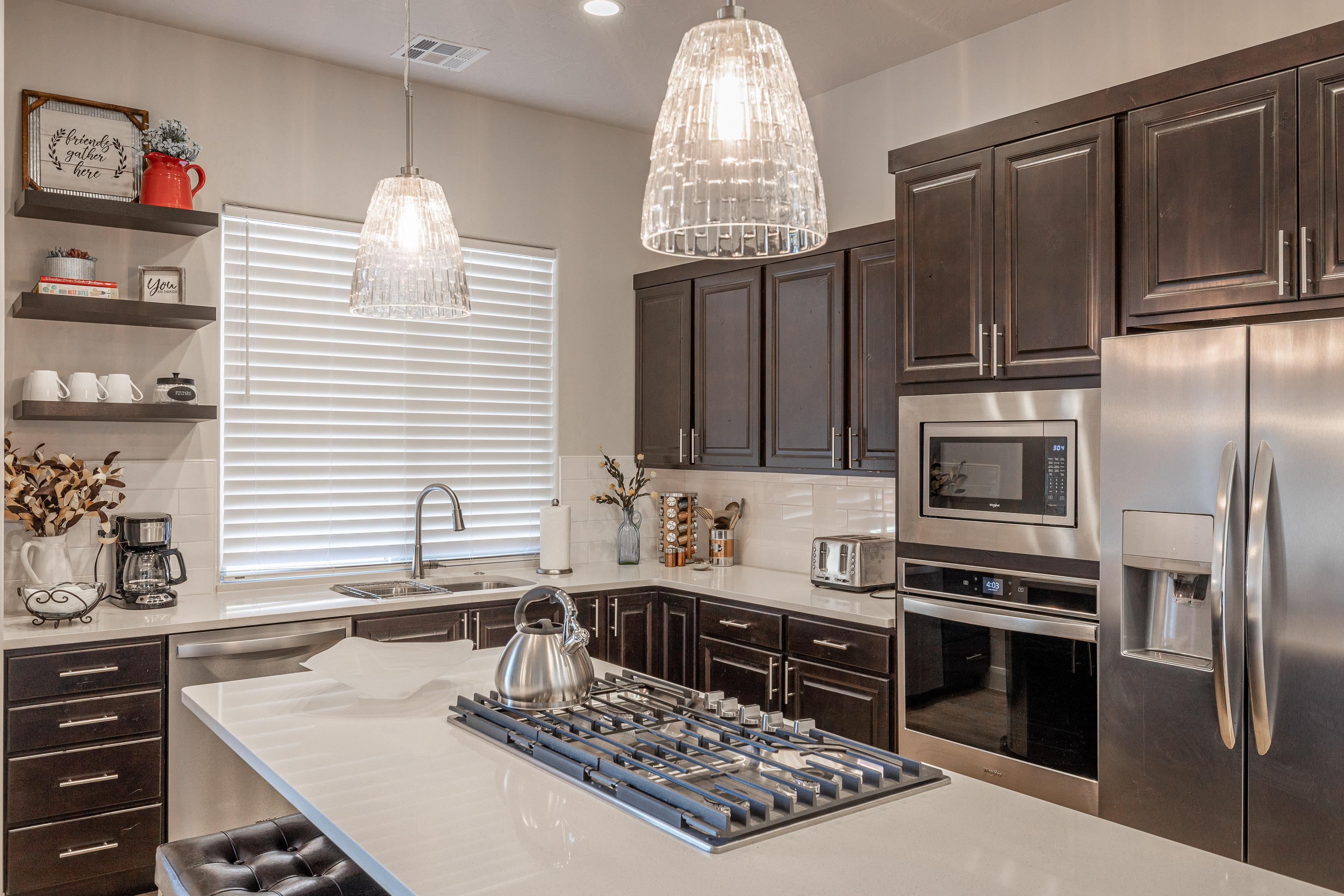 The kitchen is fully stocked with all the dishes, cookware, baking pans, and cutlery you will need for meal preparations and includes stainless steel appliances and granite counter tops. 