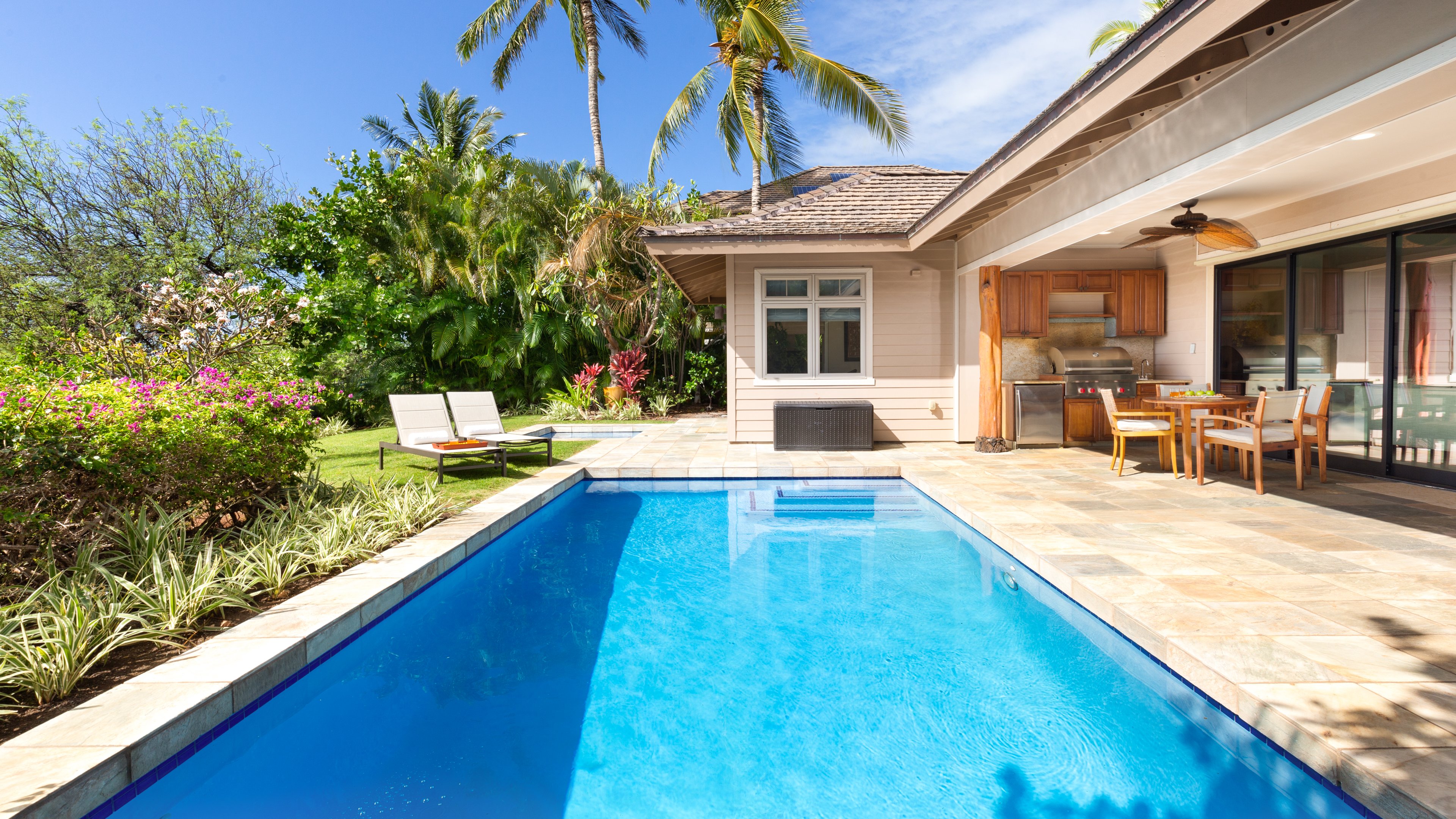 Large backyard with private pool, spa, covered lanai, all surrounded by beautiful tropical gardens.
