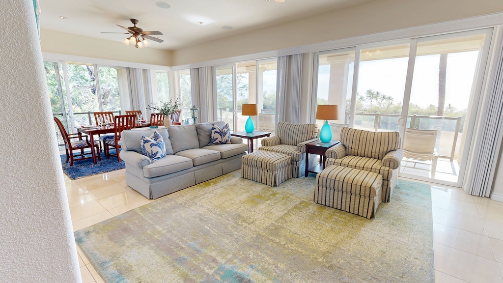 Open concept living and dining room with sunset and ocean views