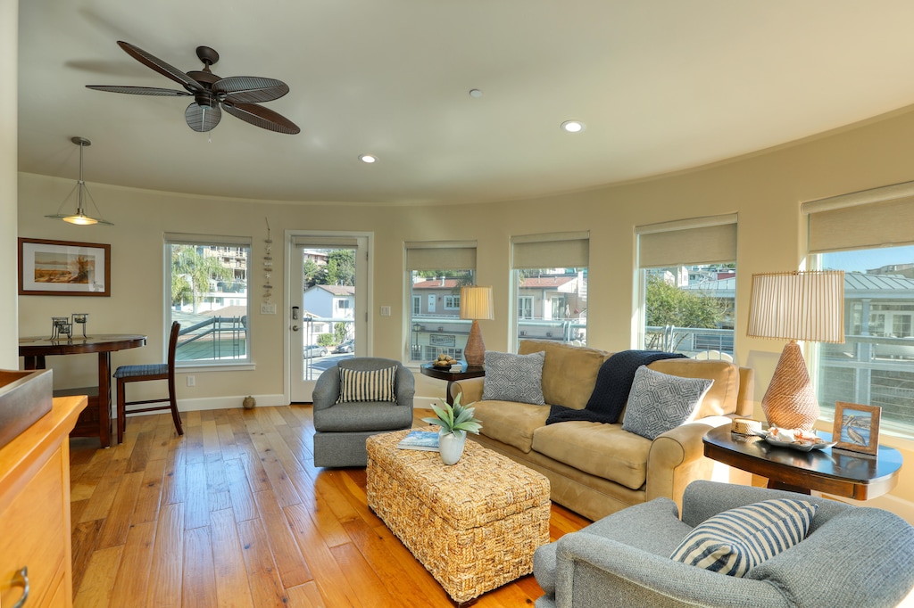The spacious living room runs parallel to the deck.