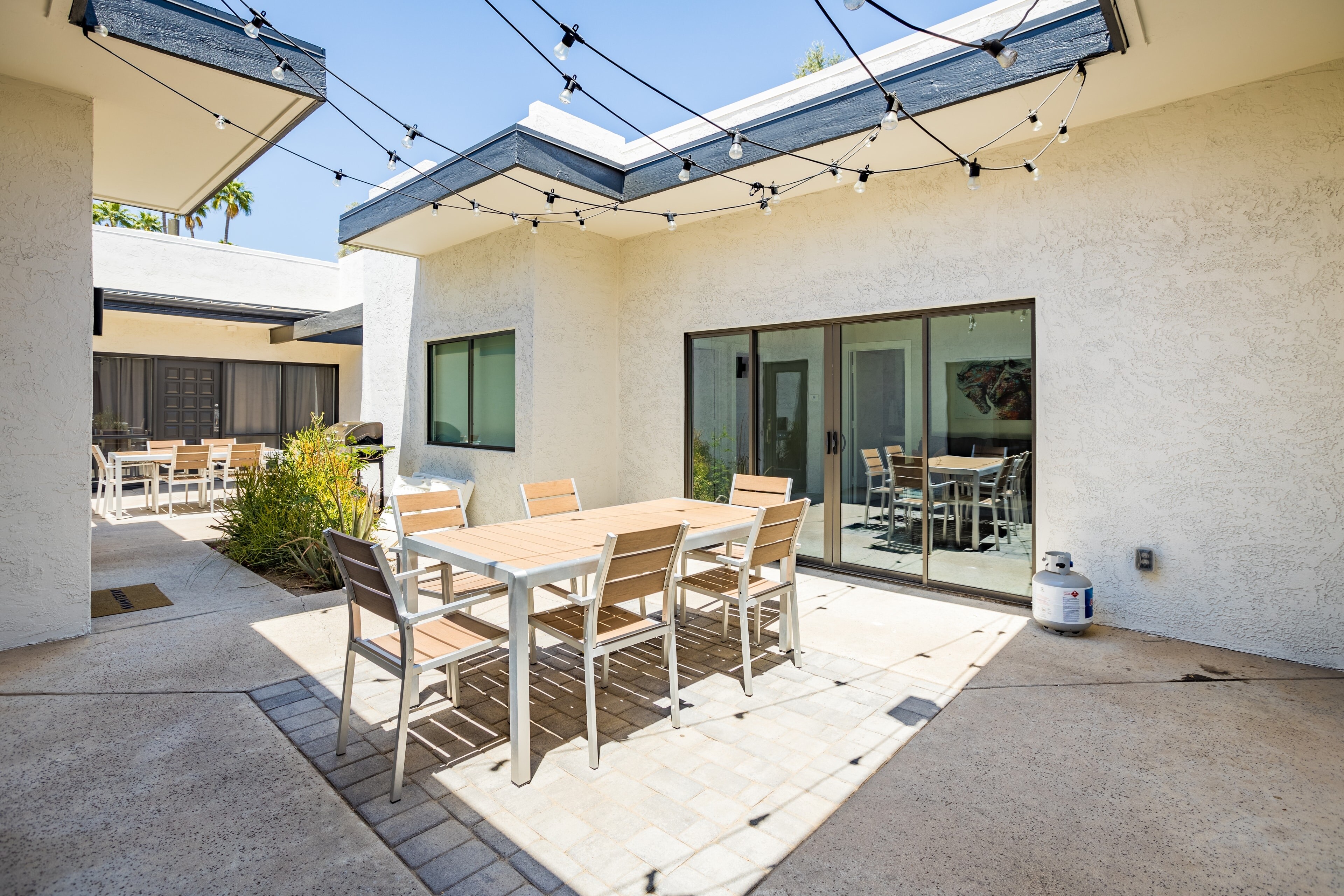 Luna and Stellar share a beautiful courtyard with al fresco dining areas, grilling features, and ambient lighting.
