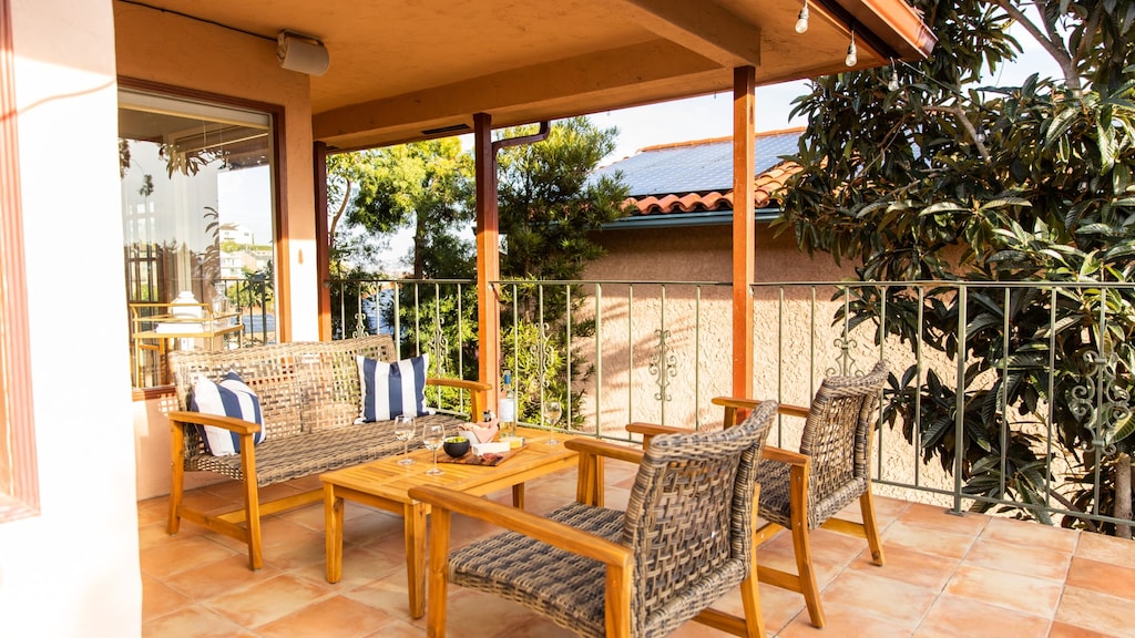 Enjoy wine and snacks at a golden hour from the second-floor balcony.