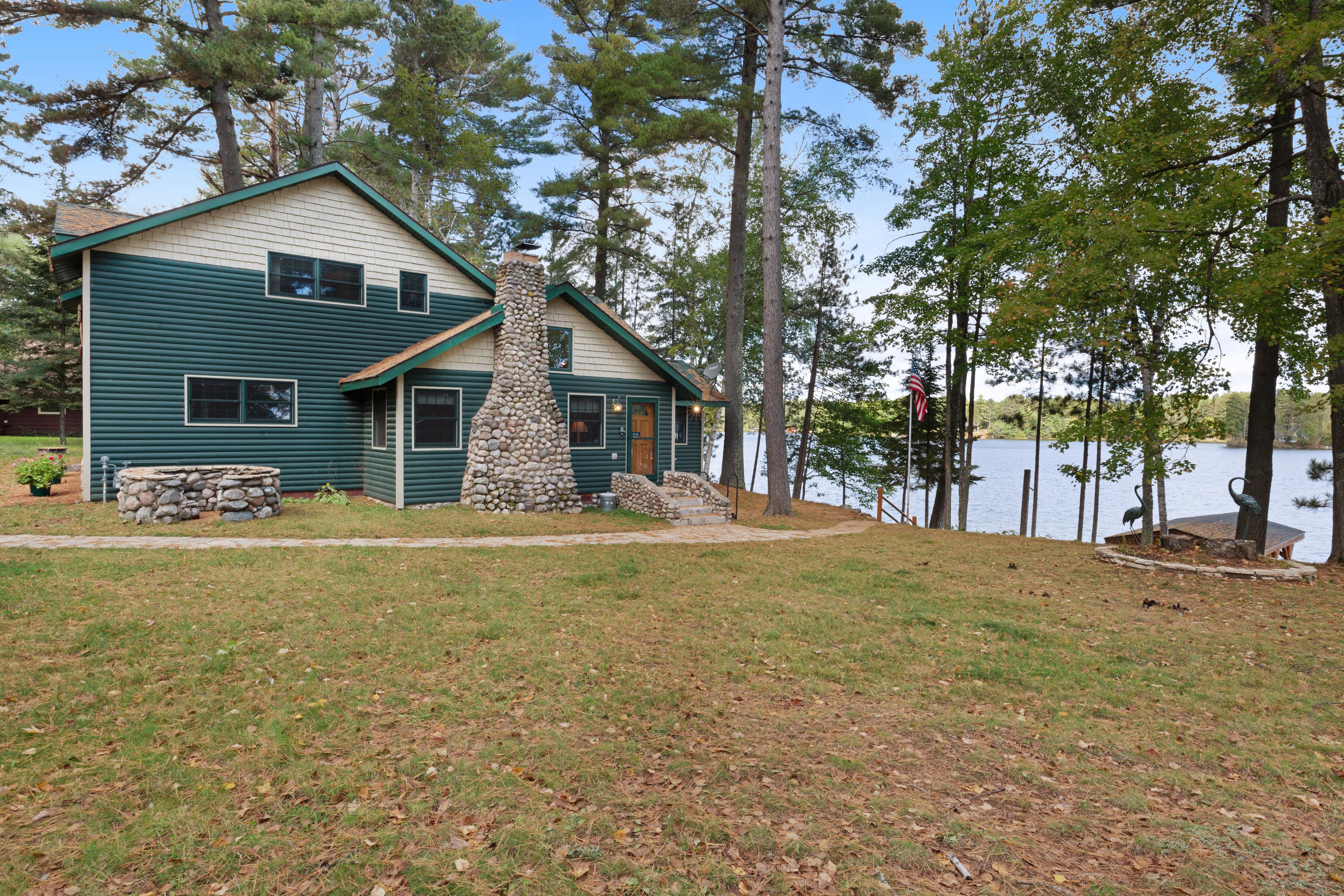 Property Image 1 - rustic charming home with incredible stone lake view - sauna & private patio