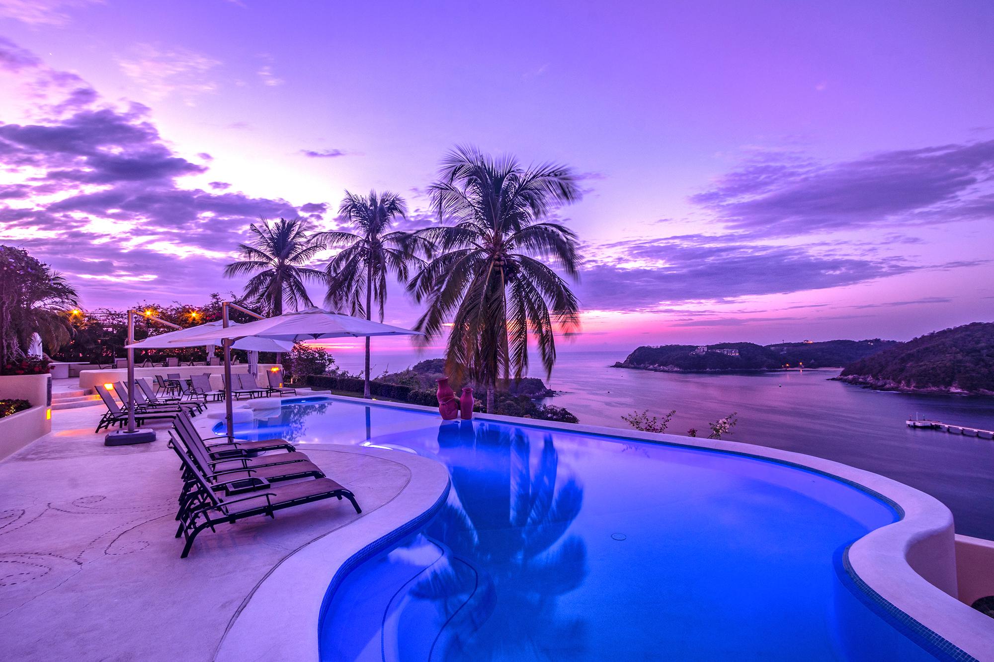 Property Image 1 - Tropical Oasis Showcasing Two Pools and Gated Entry