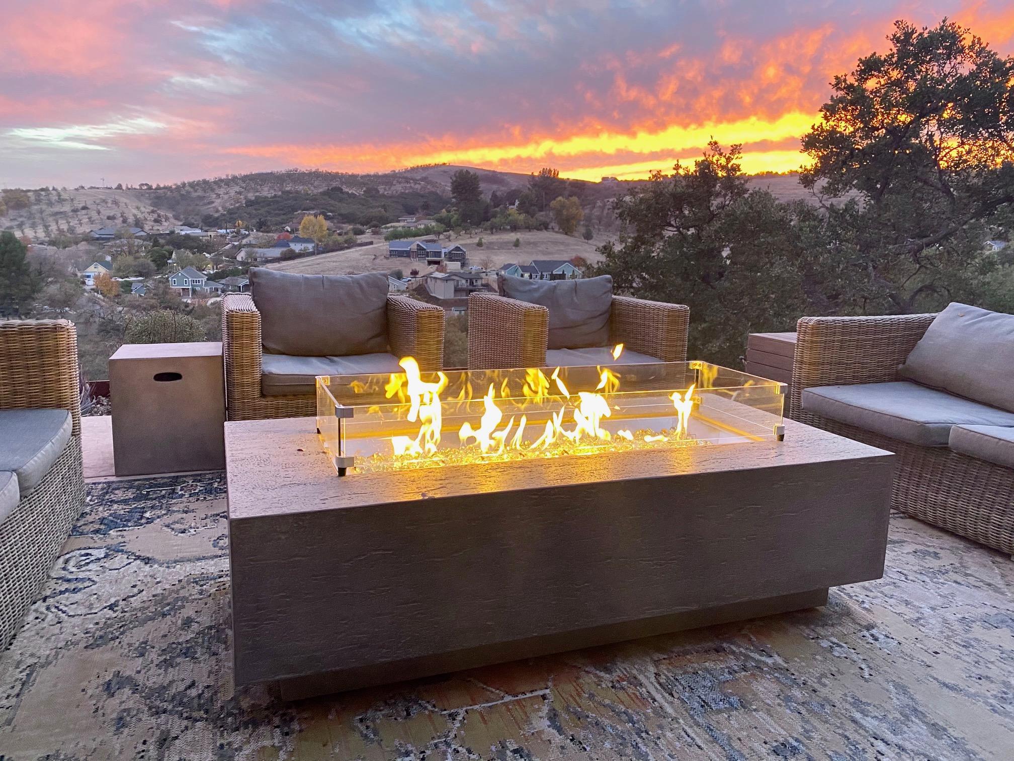 Enjoy local wines overlooking a stunning sunset and relax by the outdoor gas firepit. 