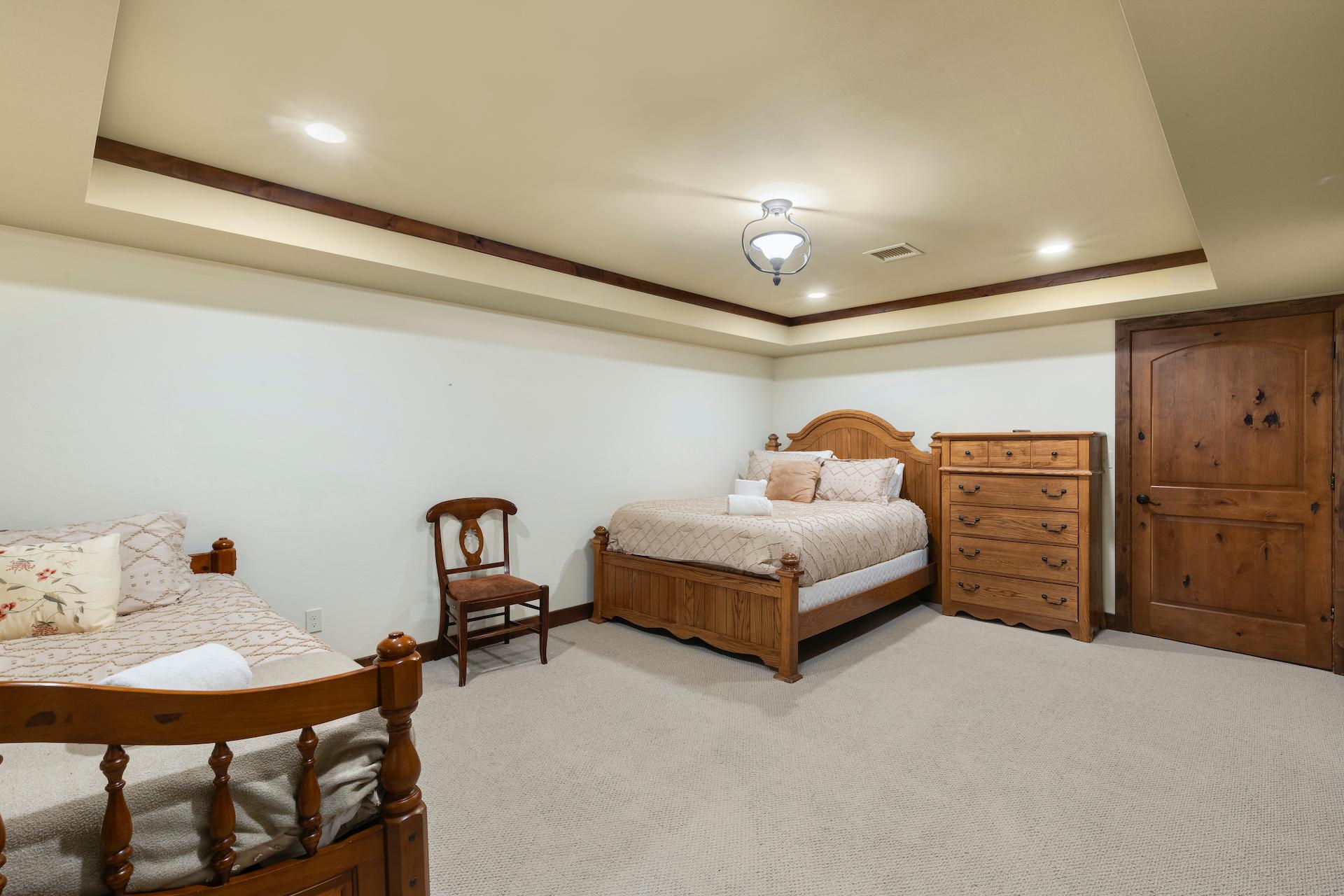 Lower Level Guest Room with Queen Bed and Two Twin Beds