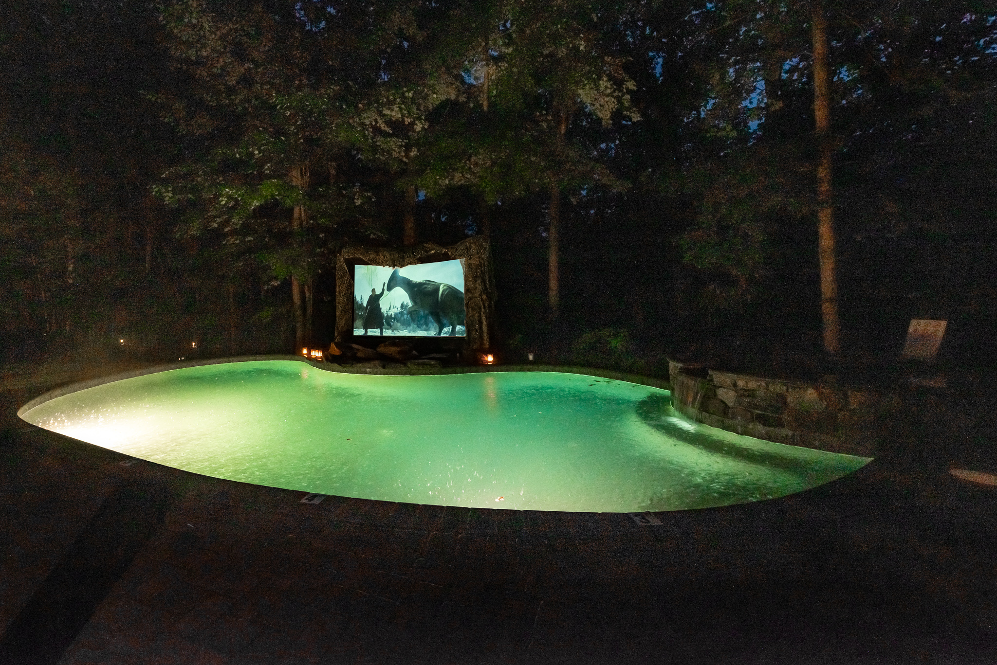 Enjoy the movie projection system by the outdoor pool!