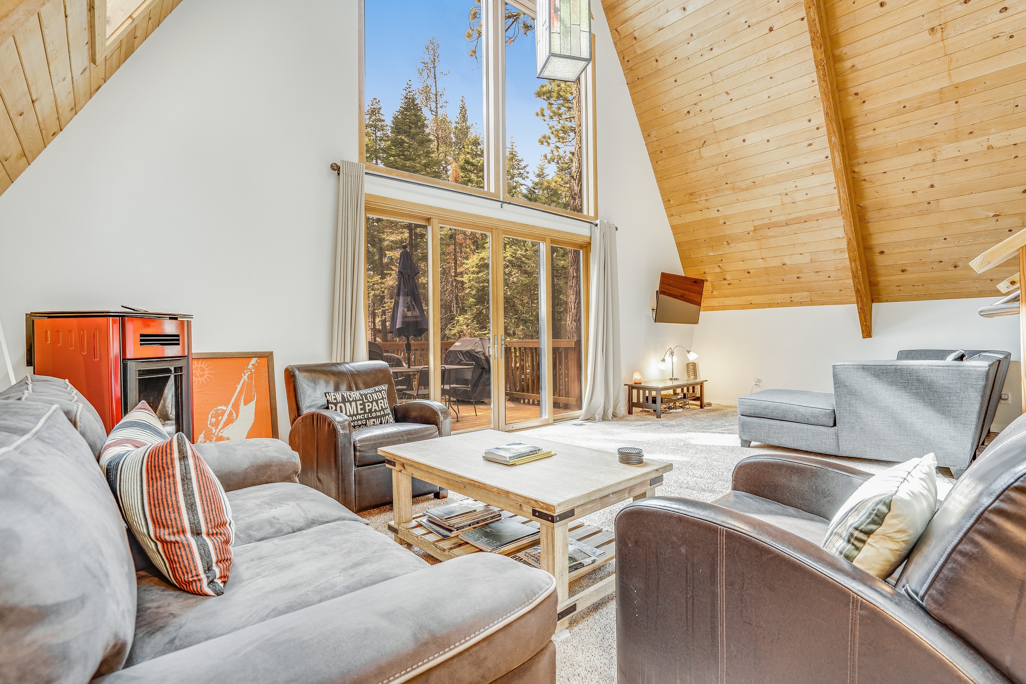 Living room features large windows for plenty of natural light.