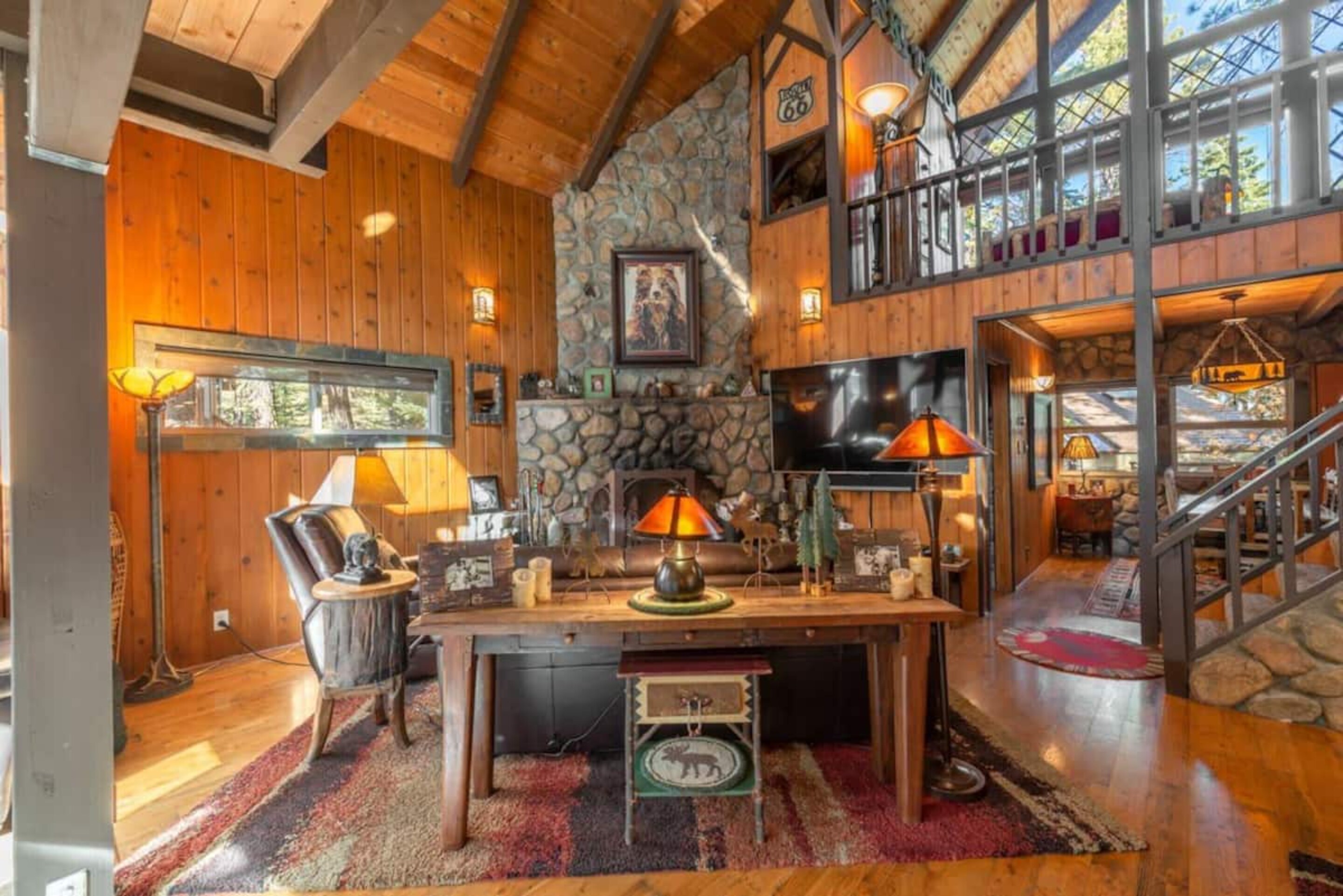 Living area features high ceilings and a traditional rustic feel.
