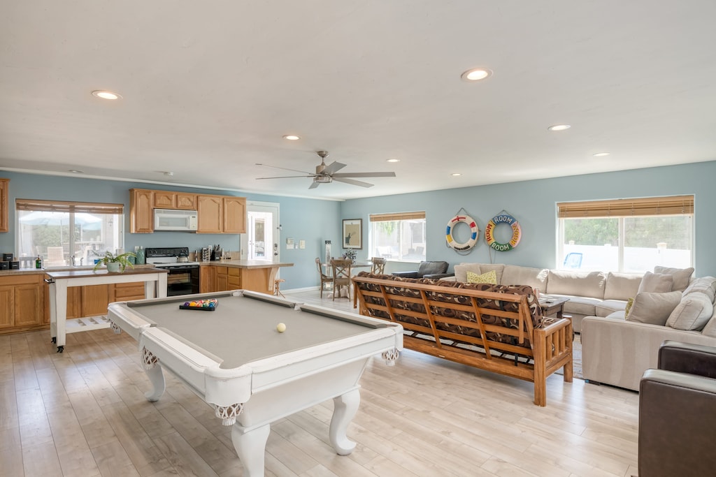 Living room in the guest house features a sitting area, pool table, dining area, and second kitchen.