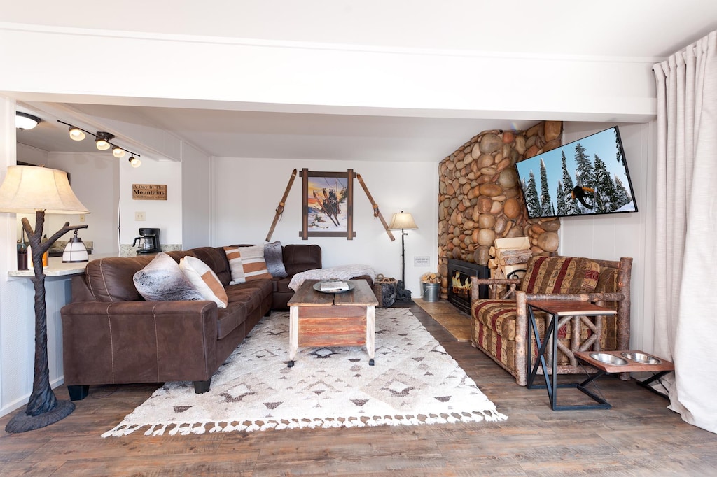 Main Living Space (TV, wood burning fireplace and deck) and awesome views