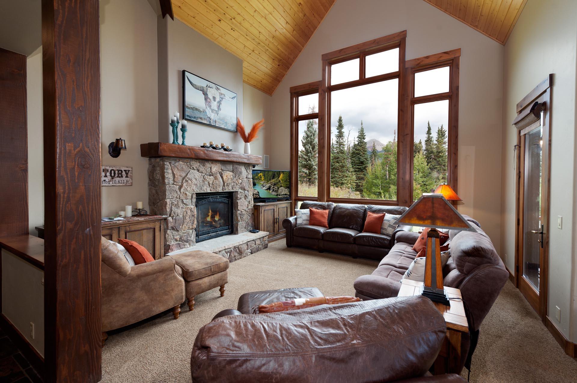 Beautiful vacation rental located just across the street from Purgatory Resort in Durango, CO. Living room with Engineer Mountain views and fireplace.