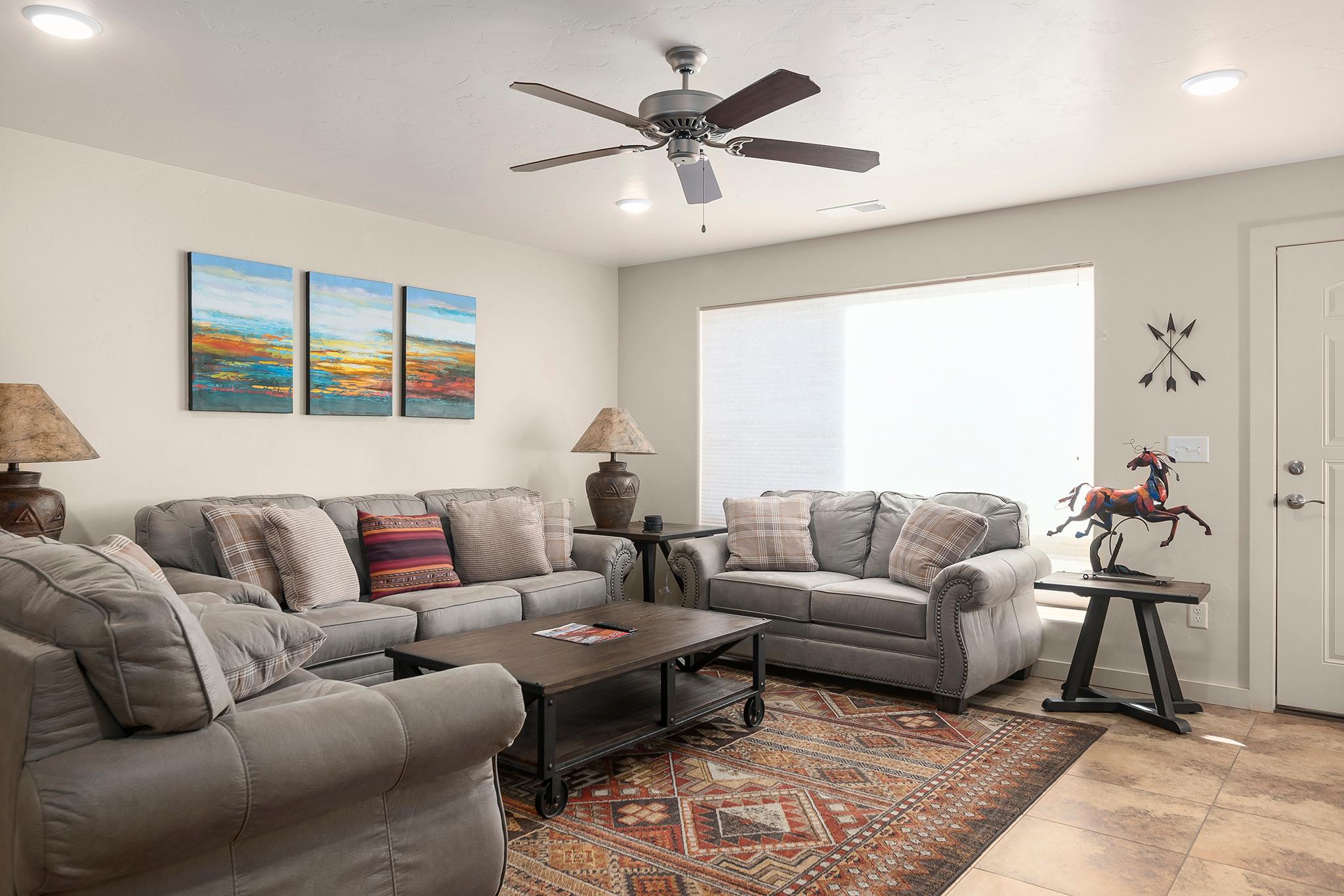 Cozy living room with flat screen tv, cable and views of the Moab Rim