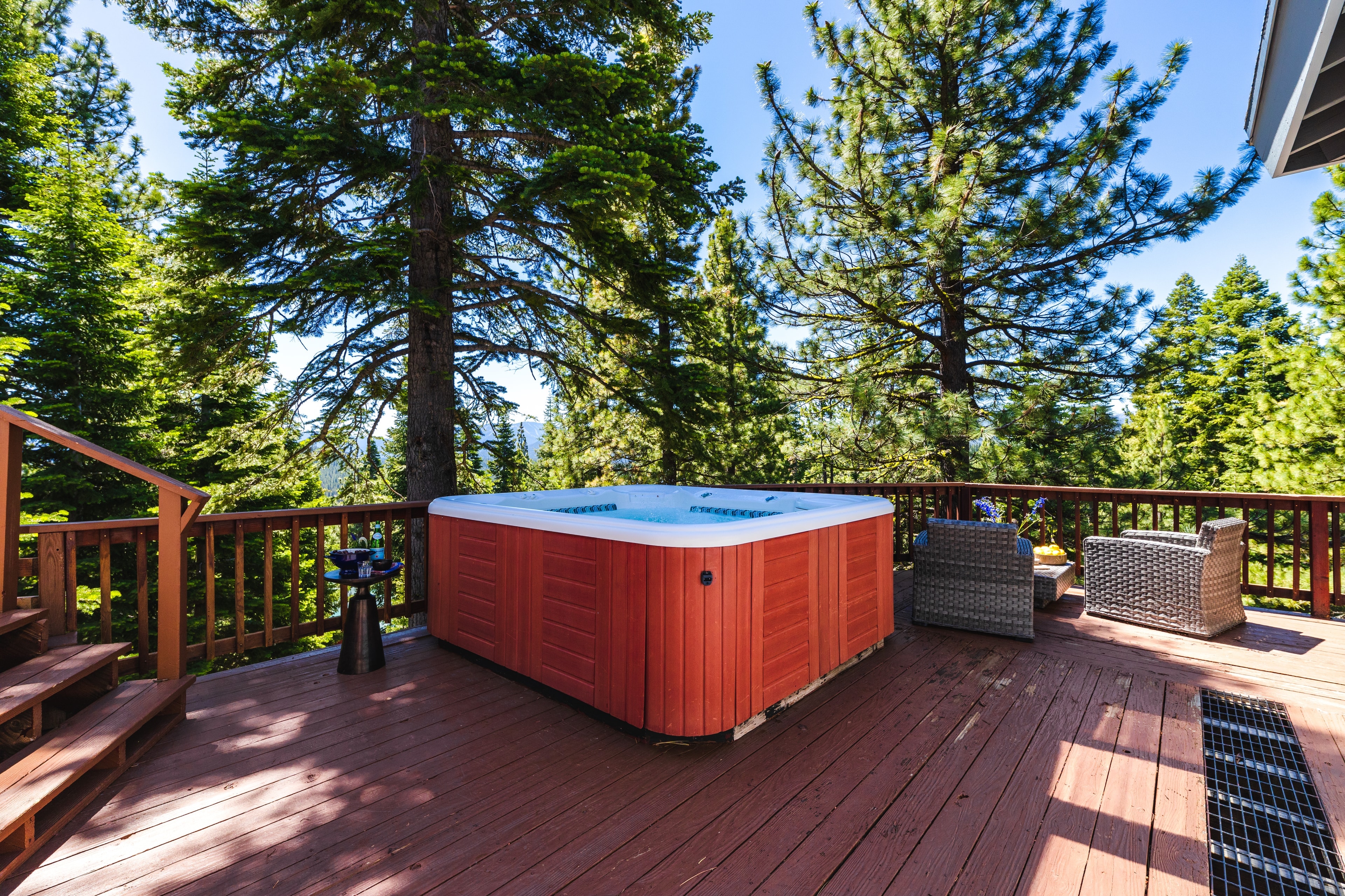 Take a dip in the hot tub surrounded by the trees.