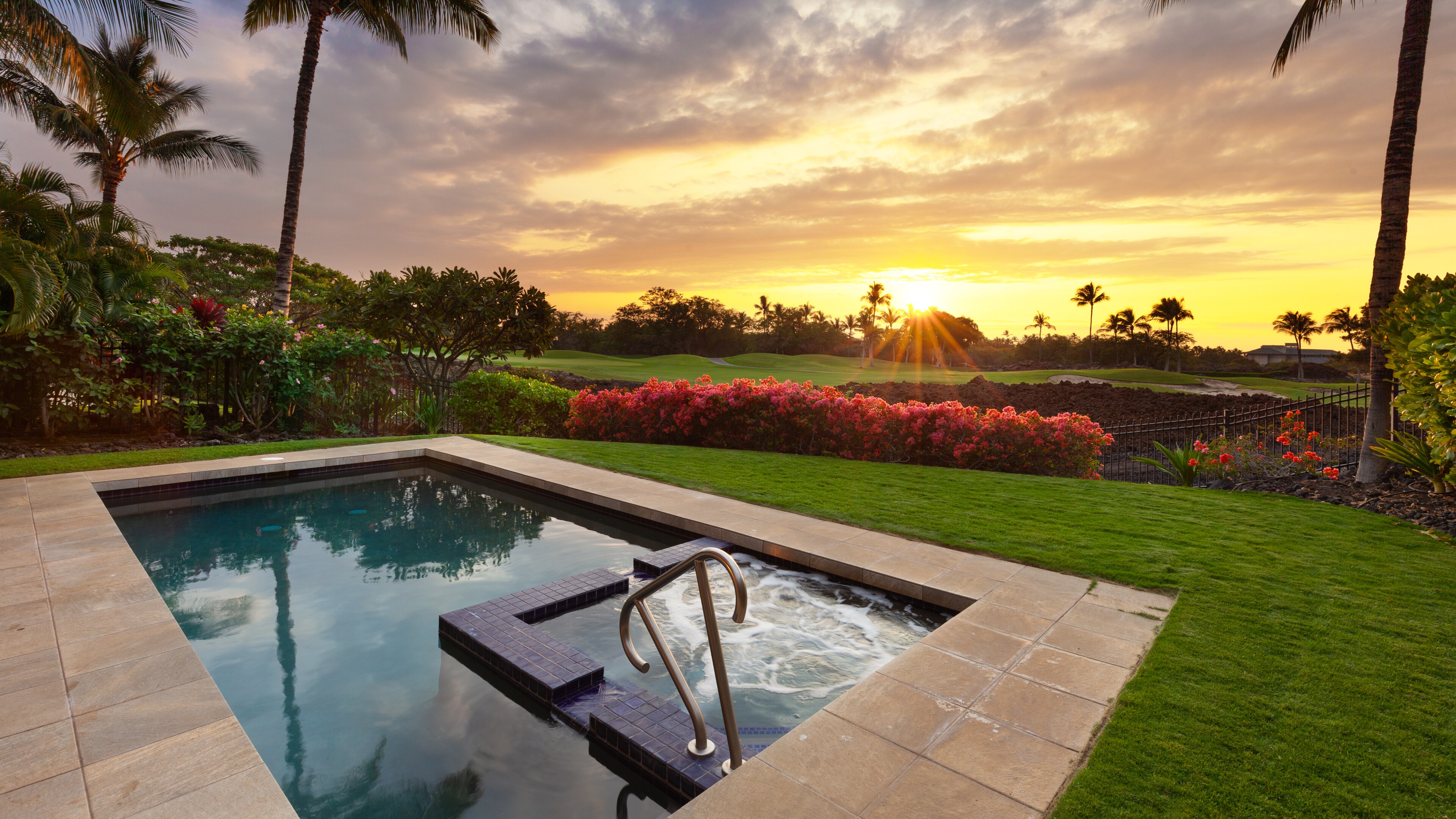 Enjoy amazing golf and sunset view from the private pool and spa in the backyard
