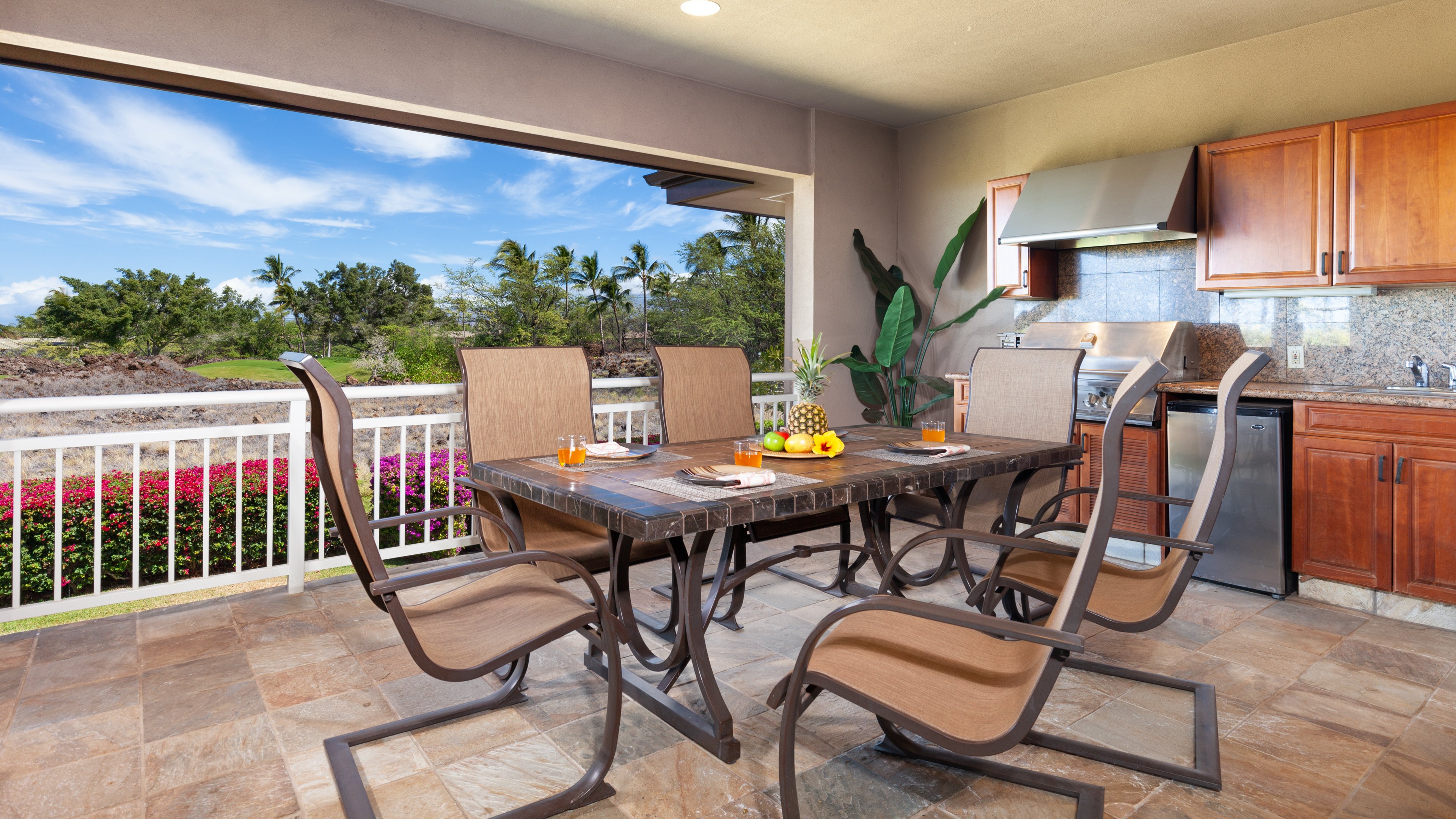 Large covered lanai overlooking golf course with high-end grill