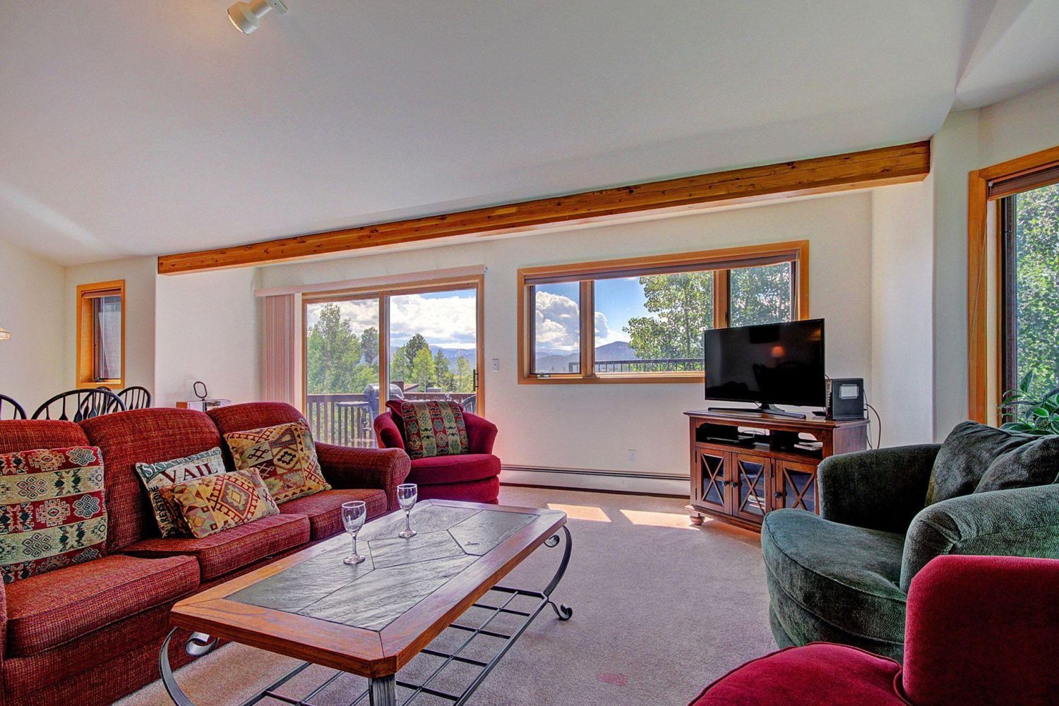 Spacious Great Room. - Featuring large windows with gorgeous views, new HD TV and console. 
