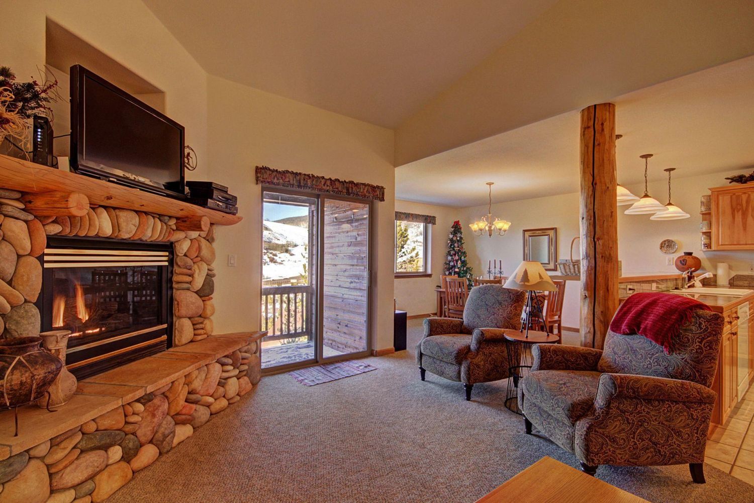Beautiful Living Area - Features a stone fireplace and HD TV.