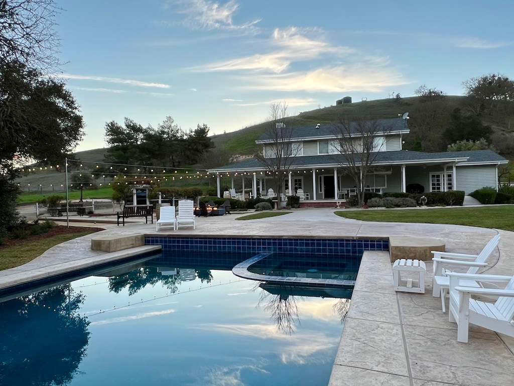View from the Main House -the gorgeous pool and spa with lounge chairs for your enjoyment