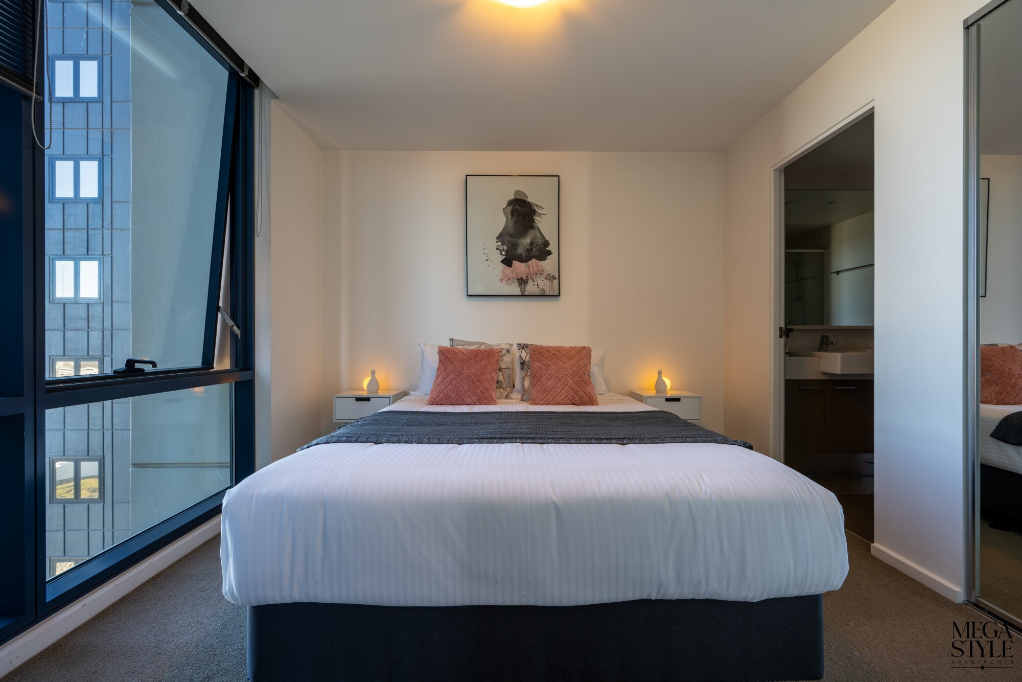The bedroom also features city views from the floor to ceiling windows