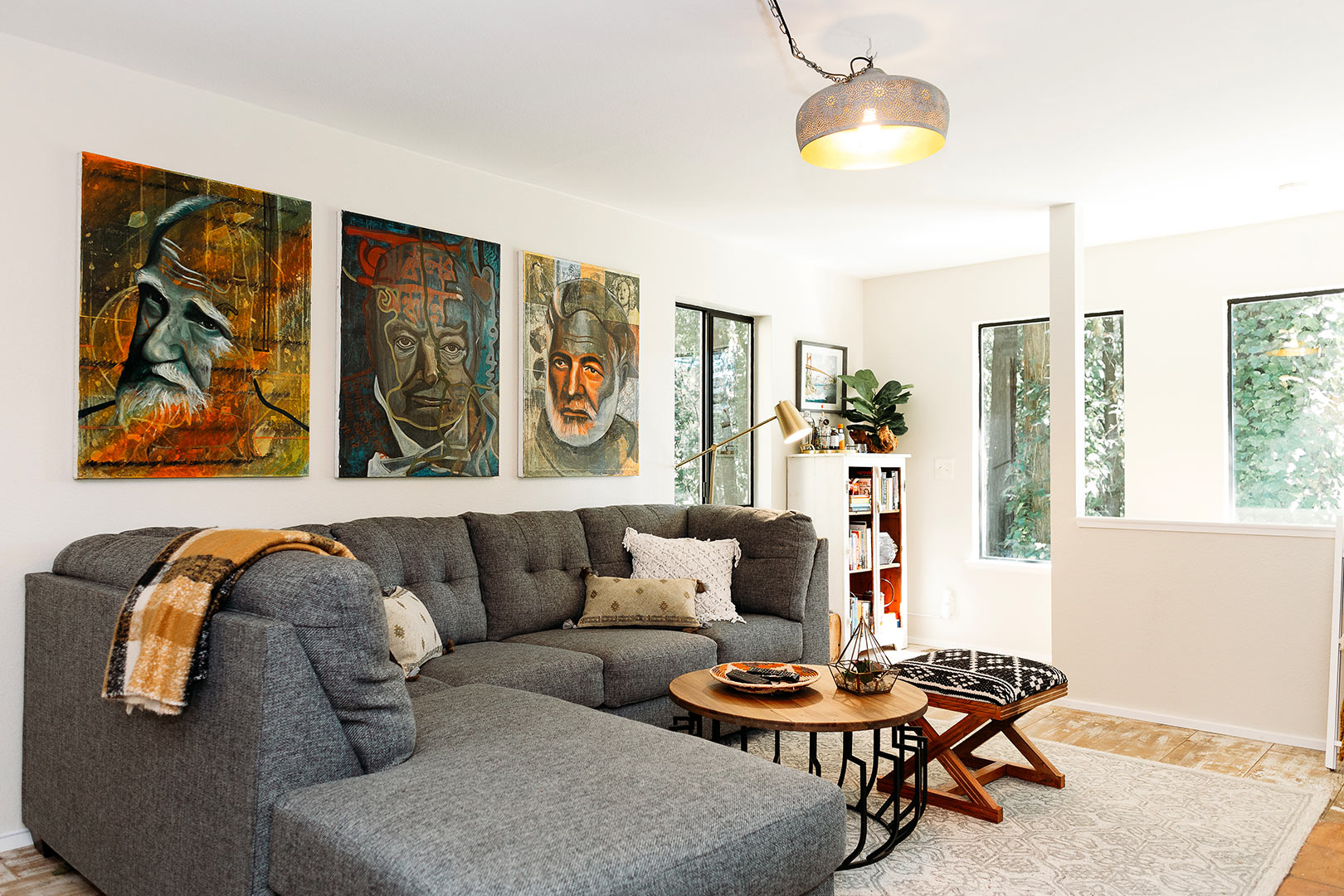Open, bright living room filled with a rotating selection of original art.