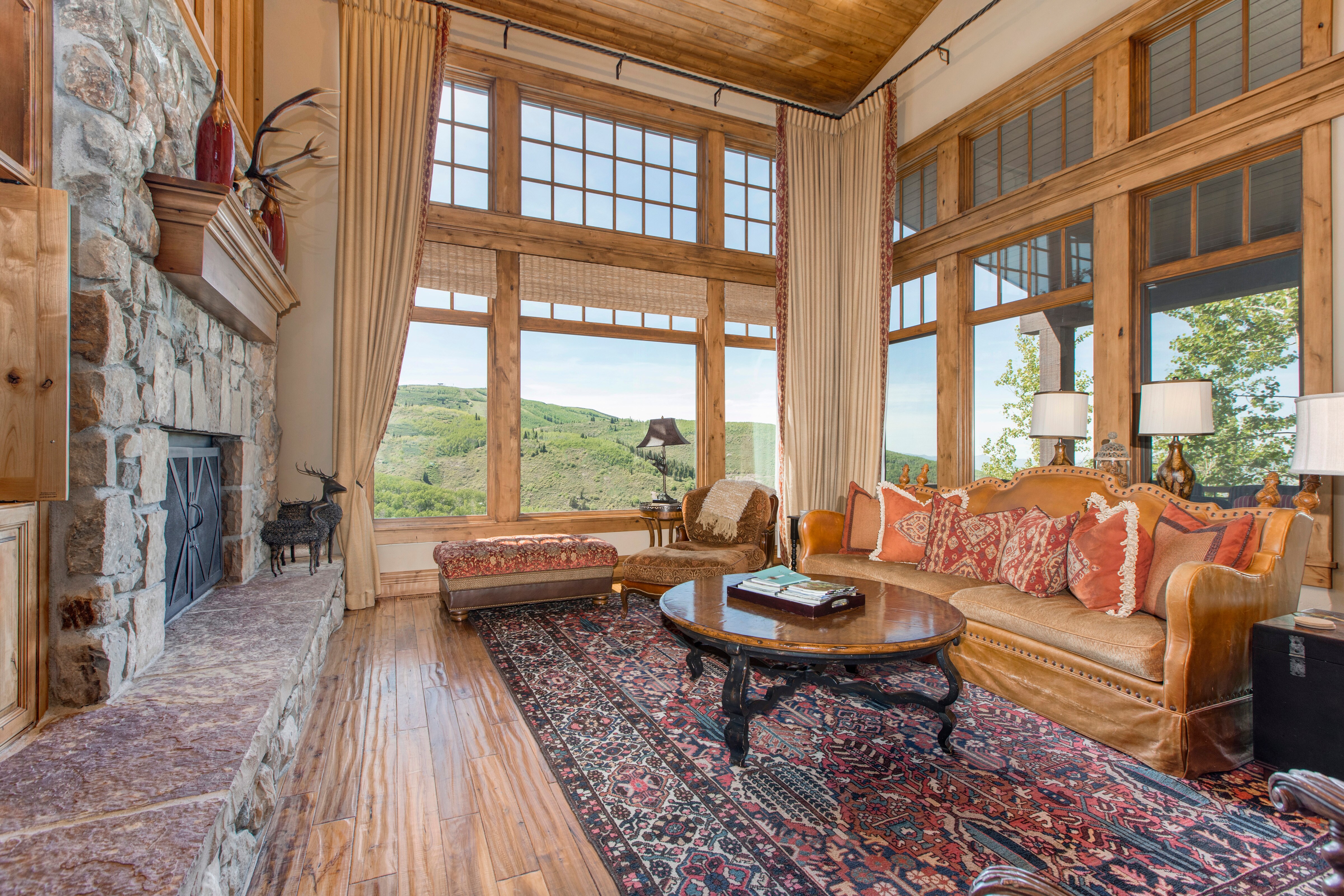 Living Room with 50" LG smart tv, private balcony, fireplace, and breathtaking views of Deer Valley and Park City