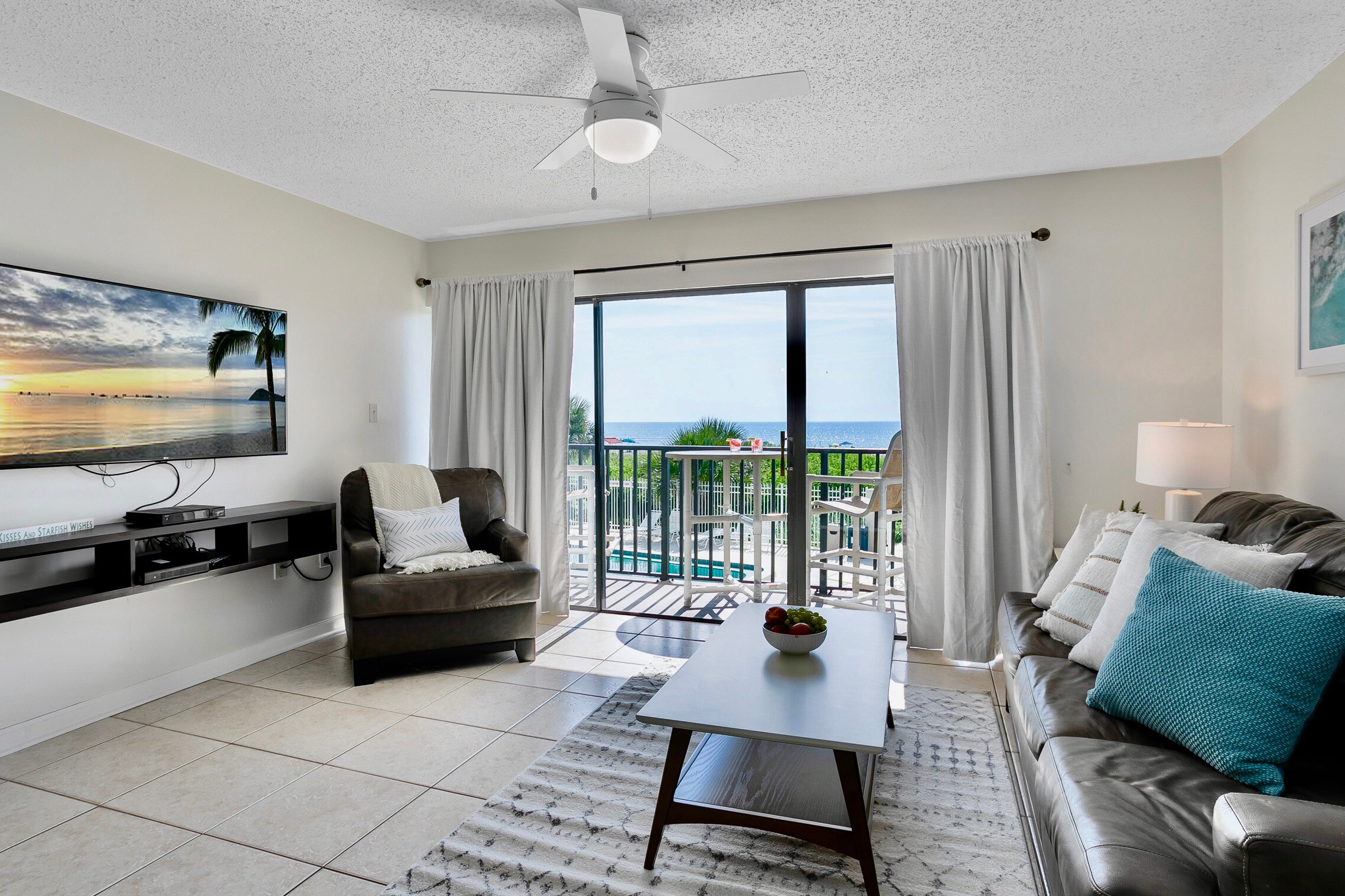 View of the ocean & 55" new BIG screen TV from your sofa.