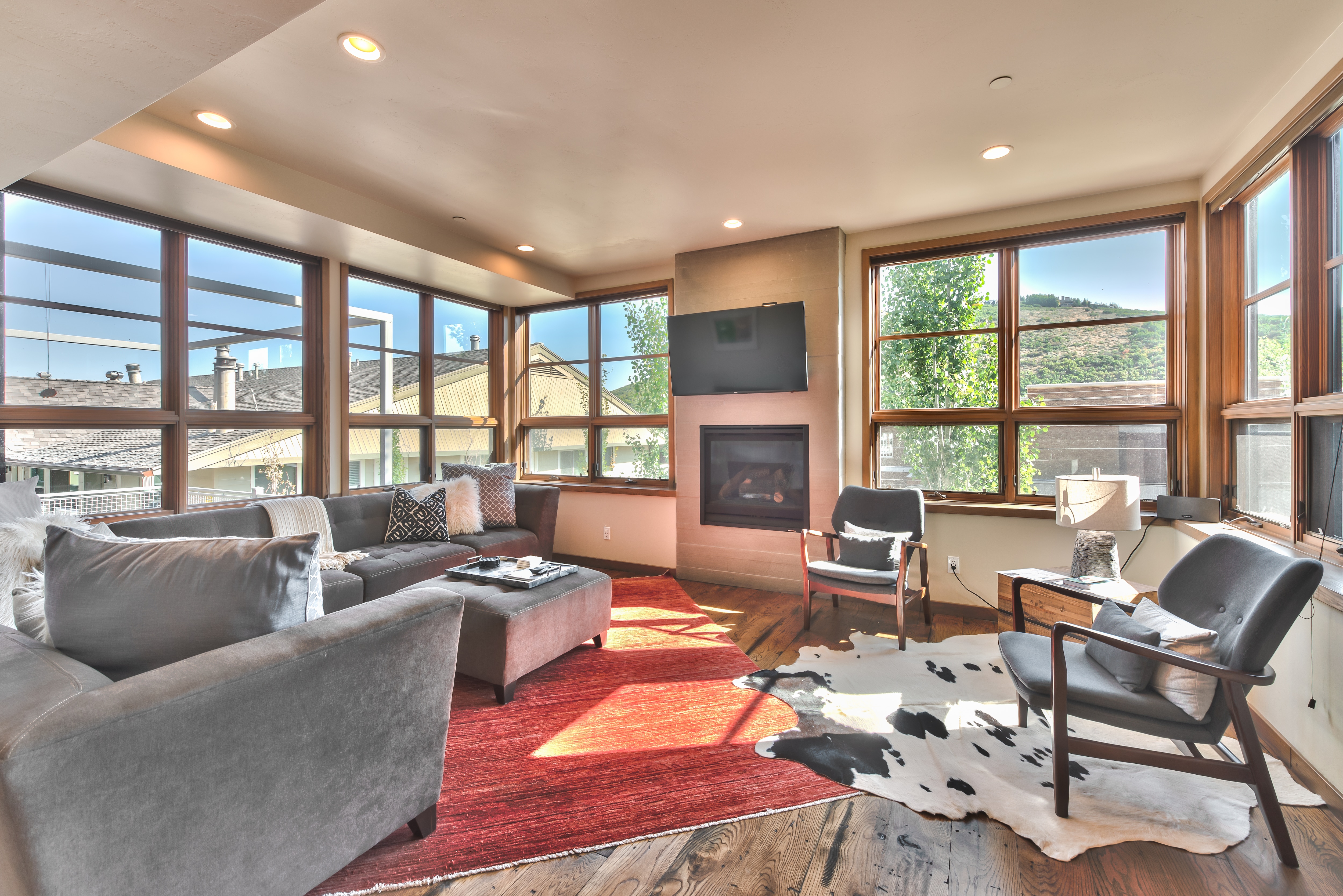 Level 2 - Living Room with Comfortable Contemporary Furnishings, Gas Fireplace, TV, Beautiful Hardwood Floors and Mountain Views