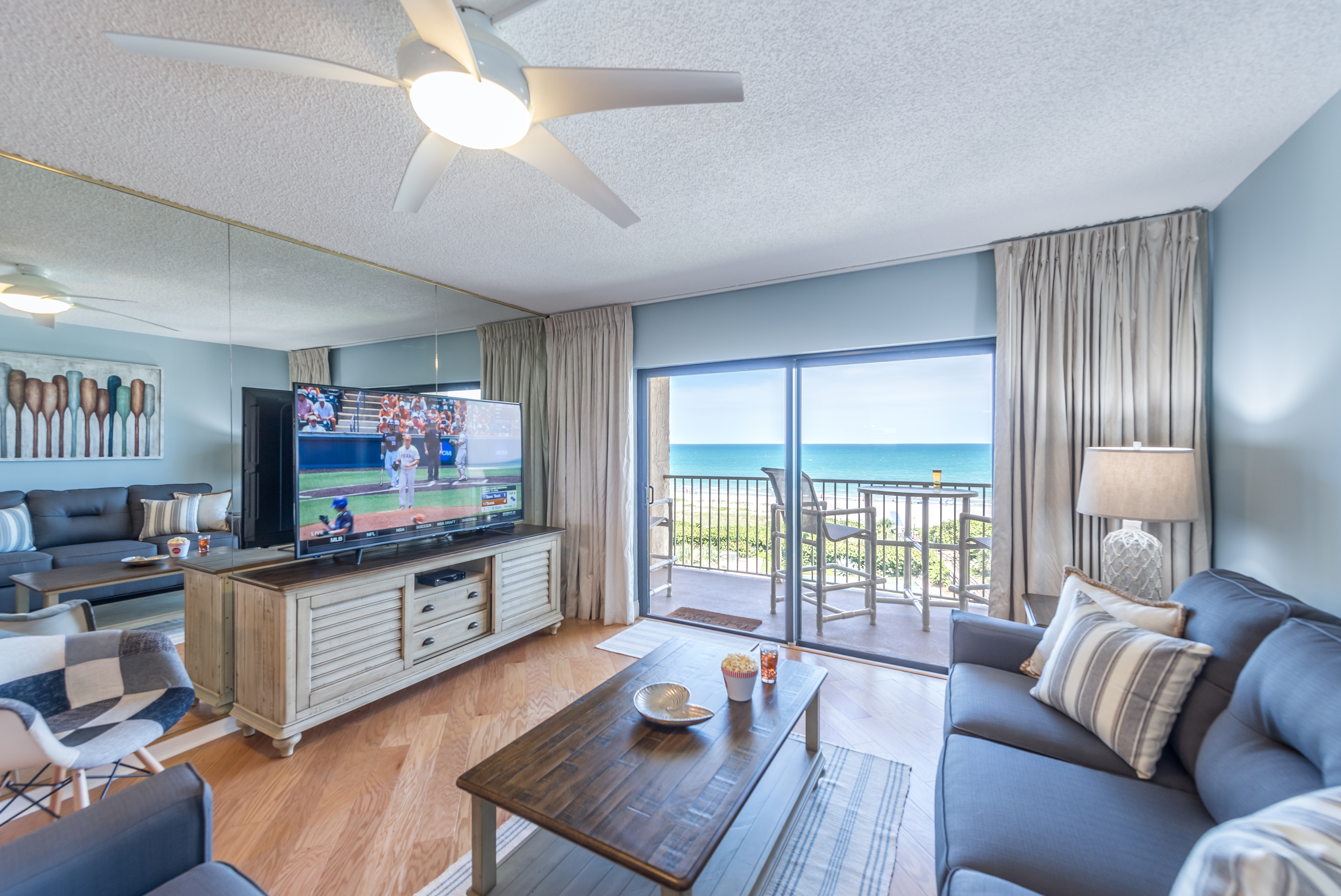 Catch the big game on this 65" HD TV with amazing views of the ocean!