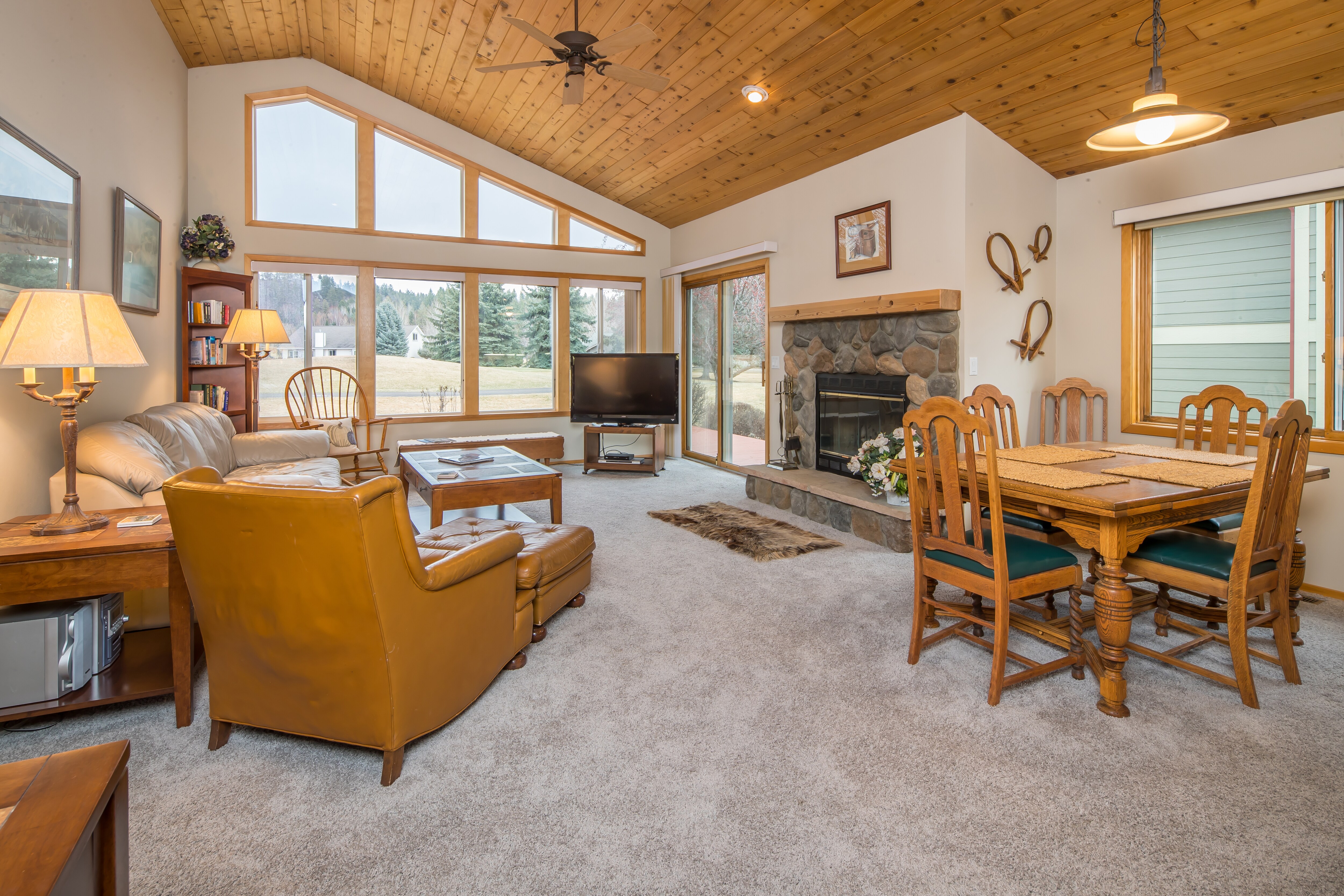 Cozy up by the fireplace and enjoy the views | Main Level