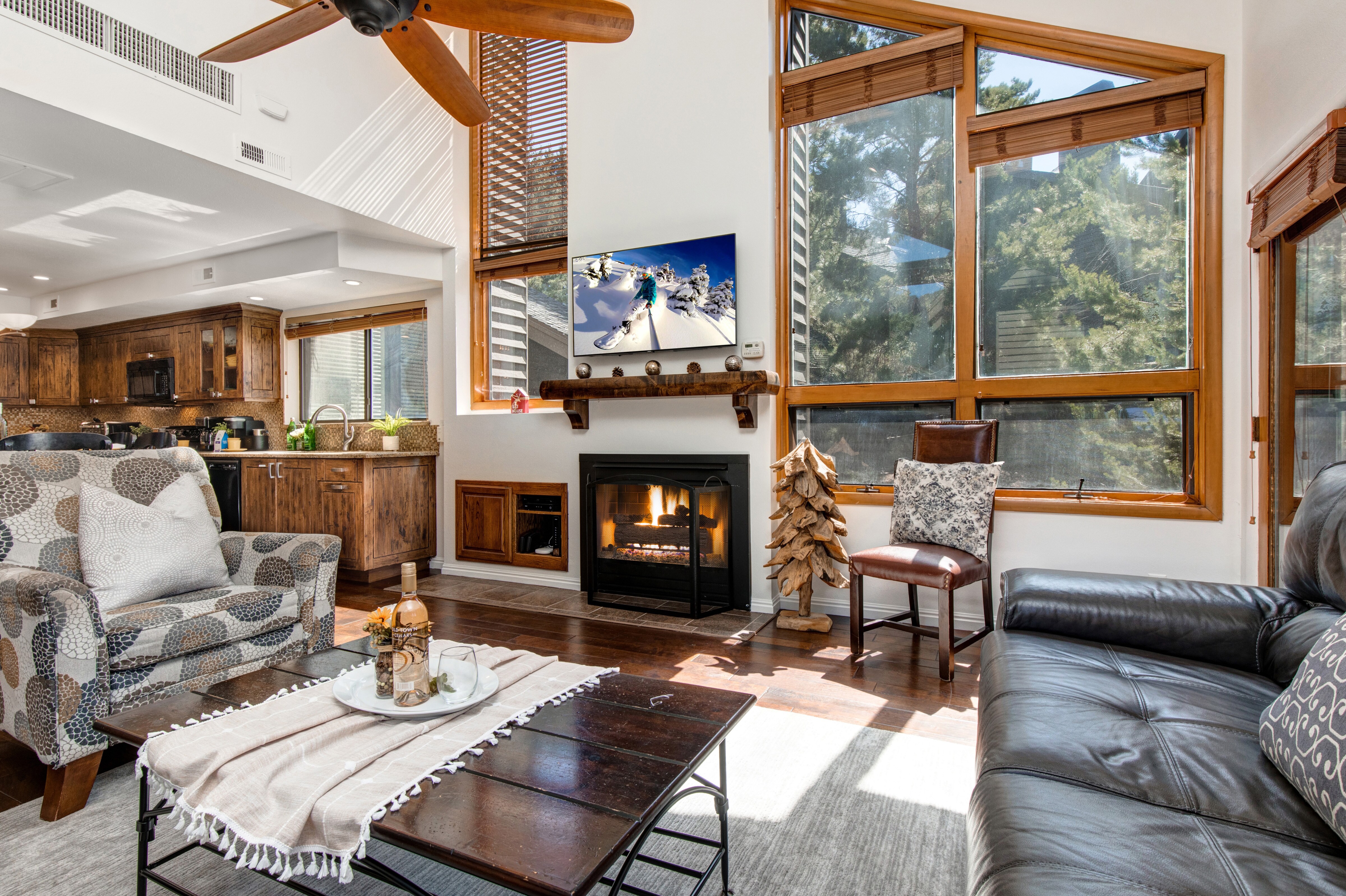 Living Room with gas fireplace, 42" Samsung TV, leather furniture and private deck access