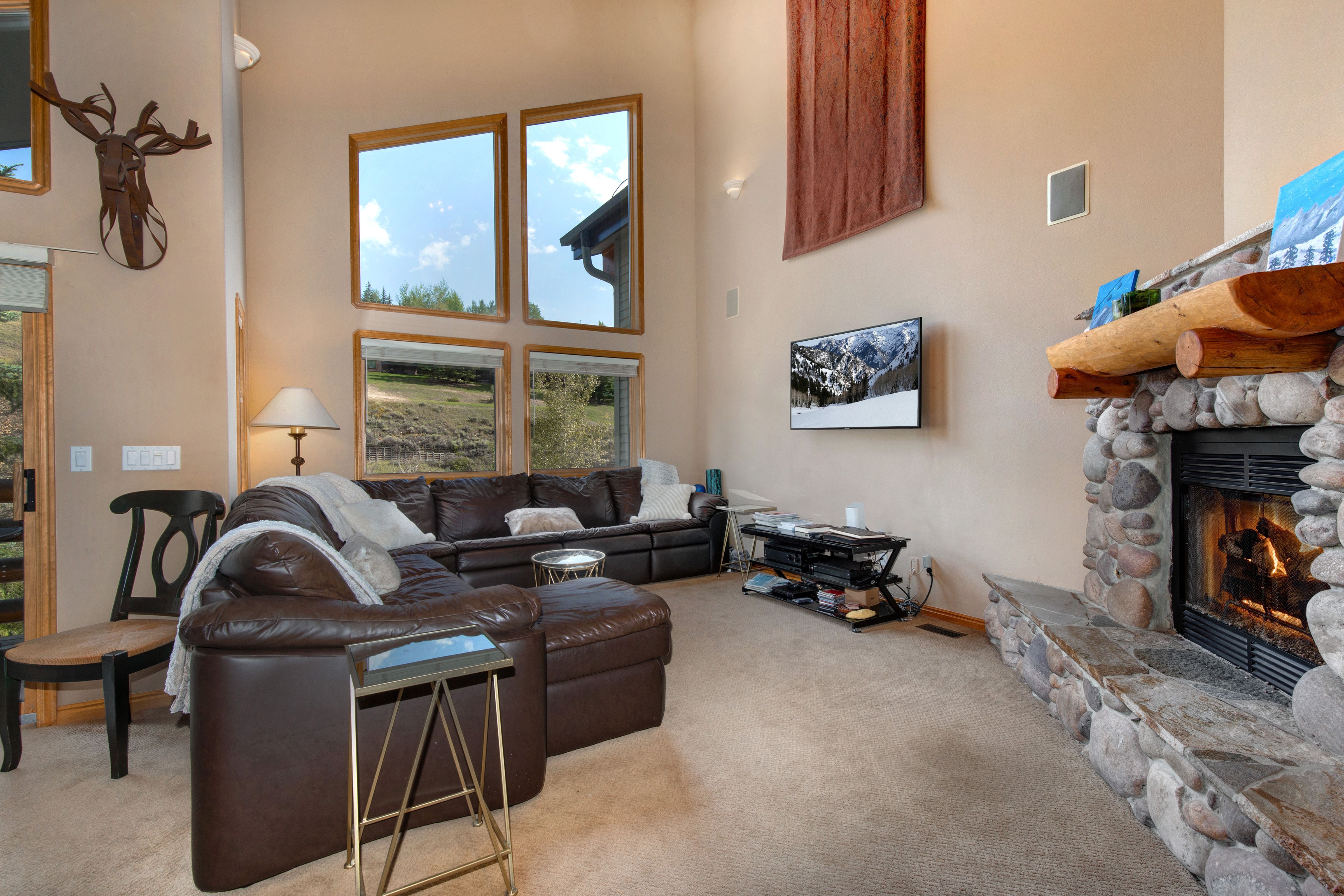 Living Room with gas fireplace, and TV