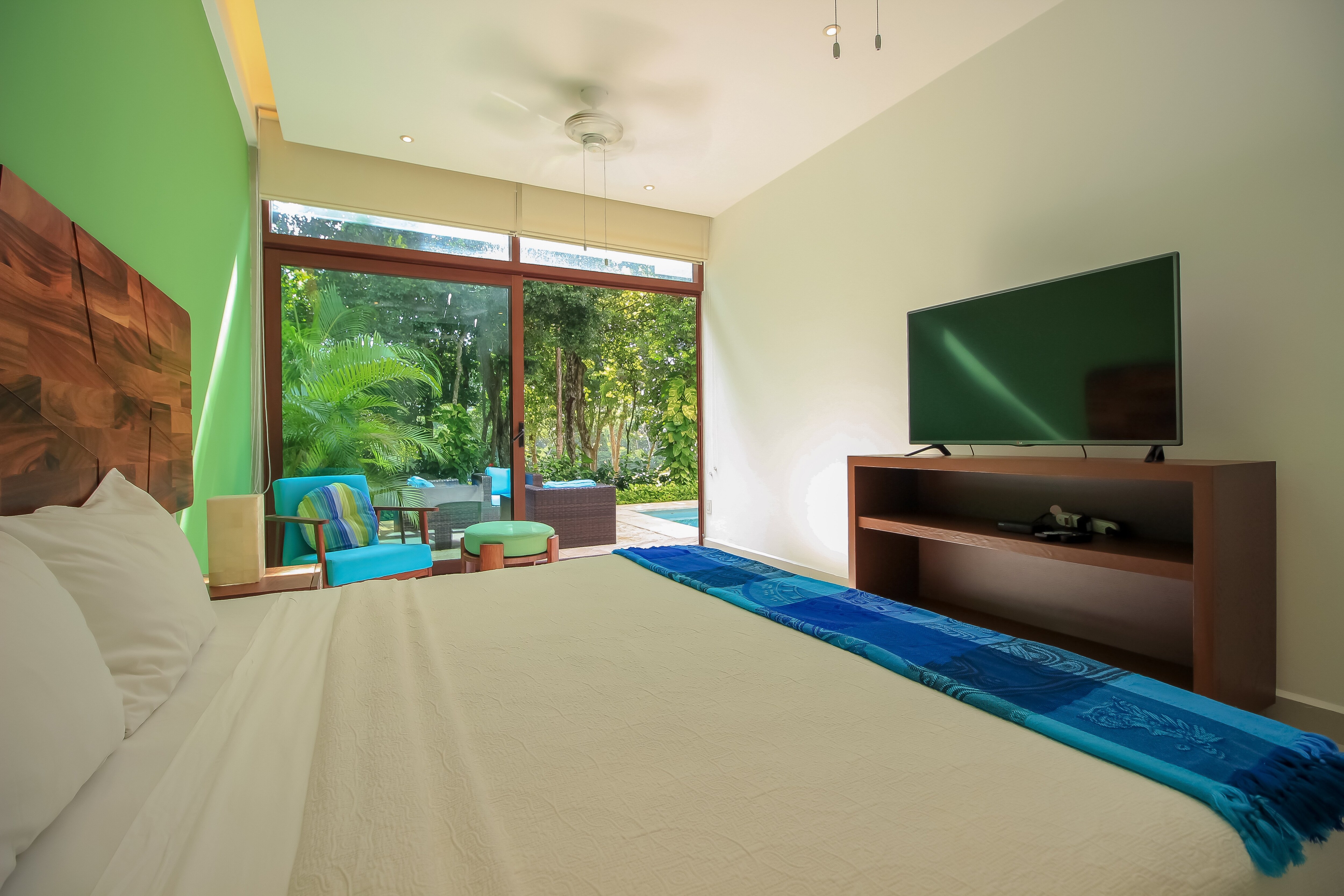 Impressive bedroom with direct access to the pool.