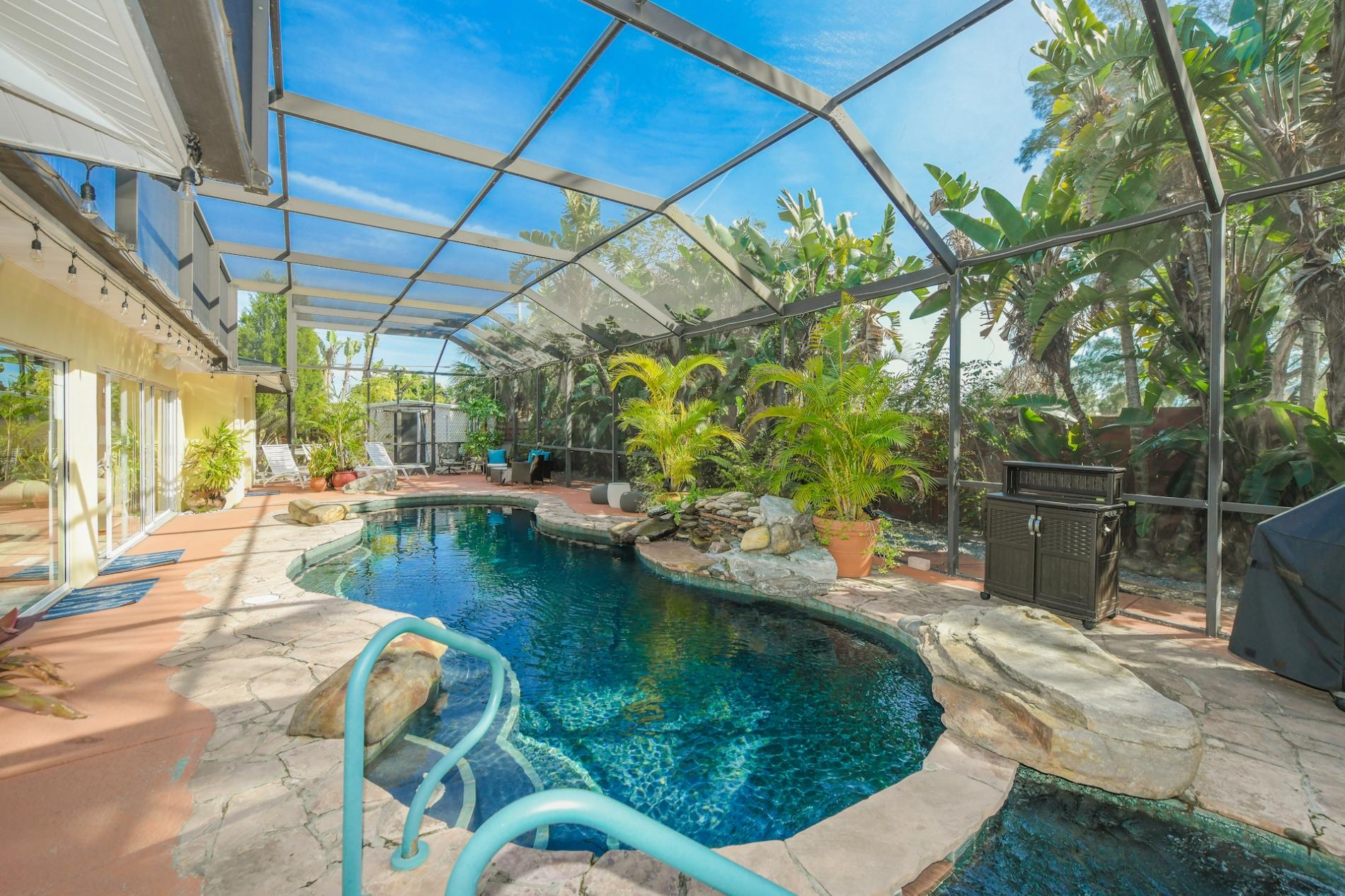 Property Image 1 - Island Time - Home w/Enclosed Lagoon Style Pool & Spa, Walk to Beach, Boat Dock, Bikes!