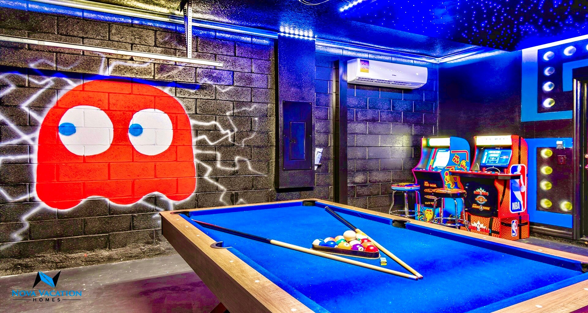 Game room includes pool table and fun game machines.