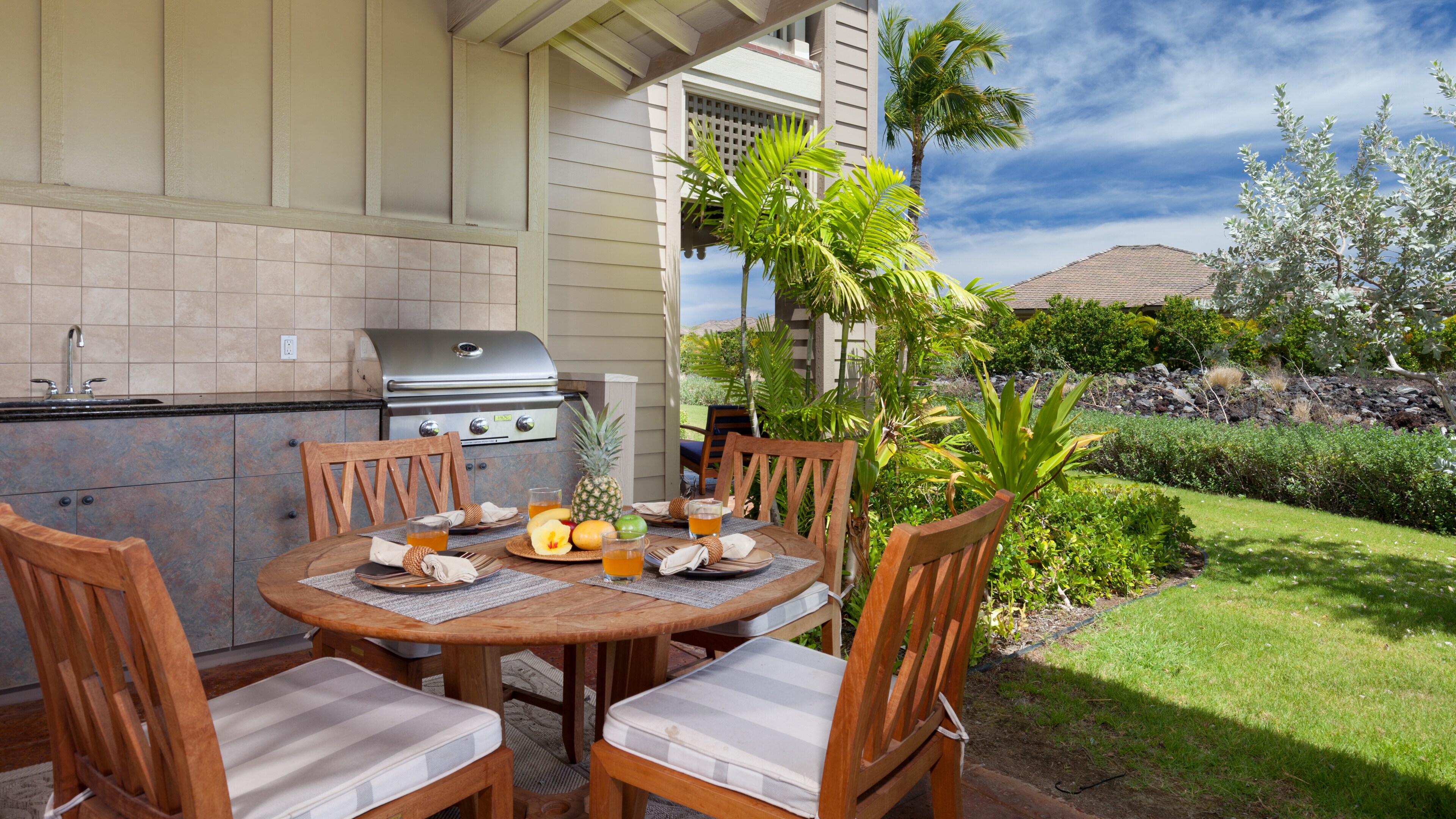 Covered lanai with private high end grill.