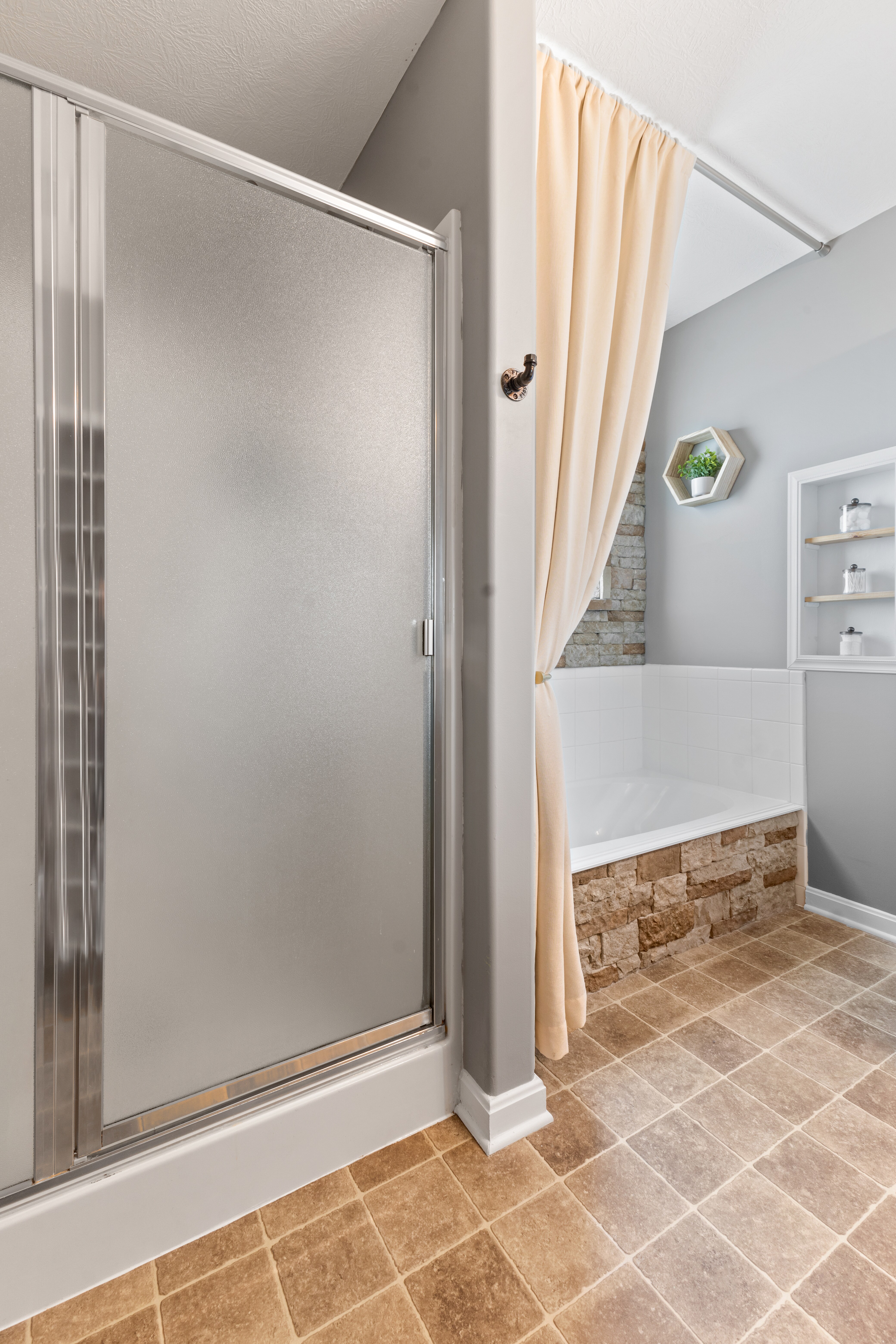 Chic bathroom features a frosted glass shower