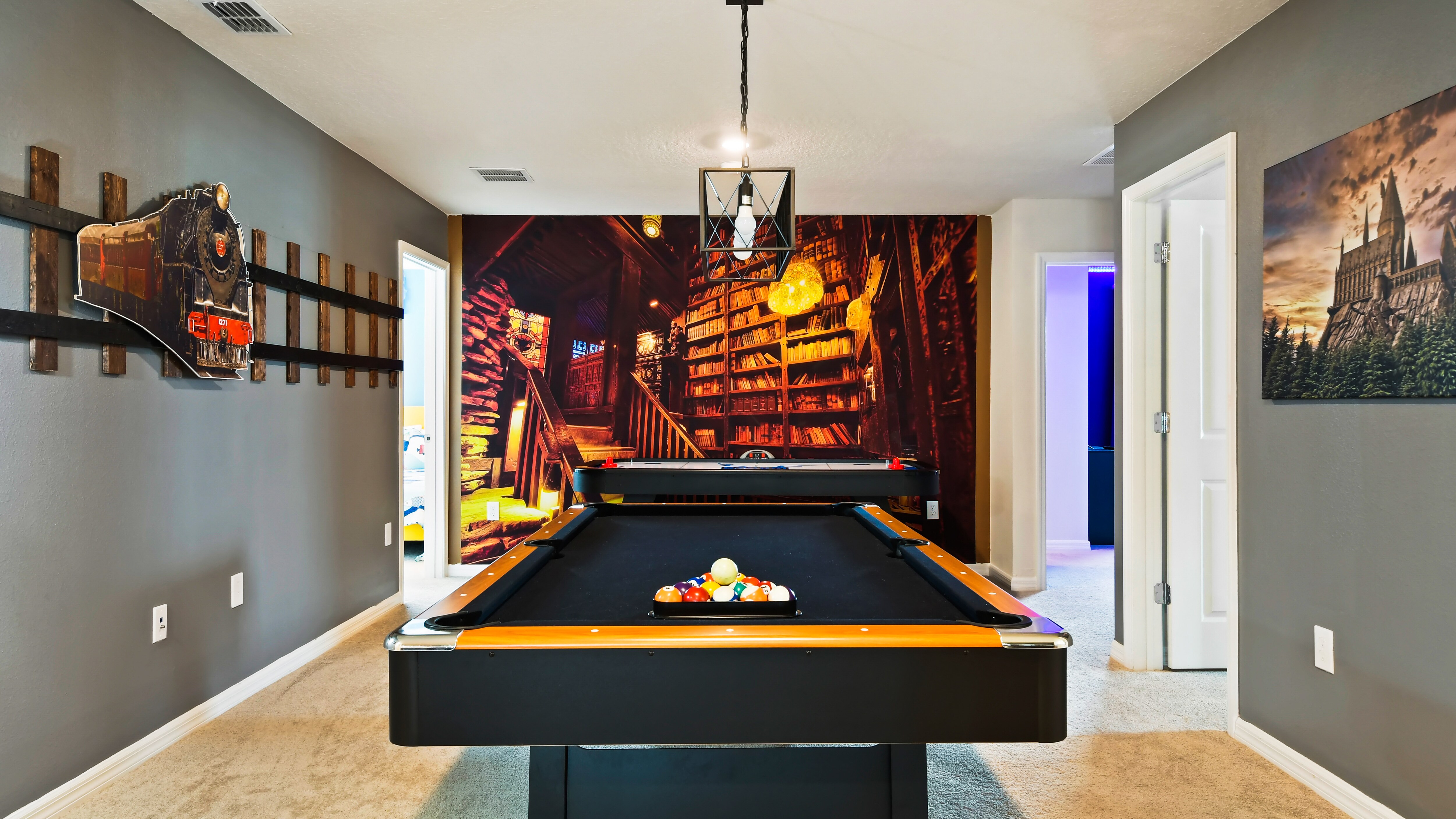 Have a hit of pool with friends in the upstairs game loft