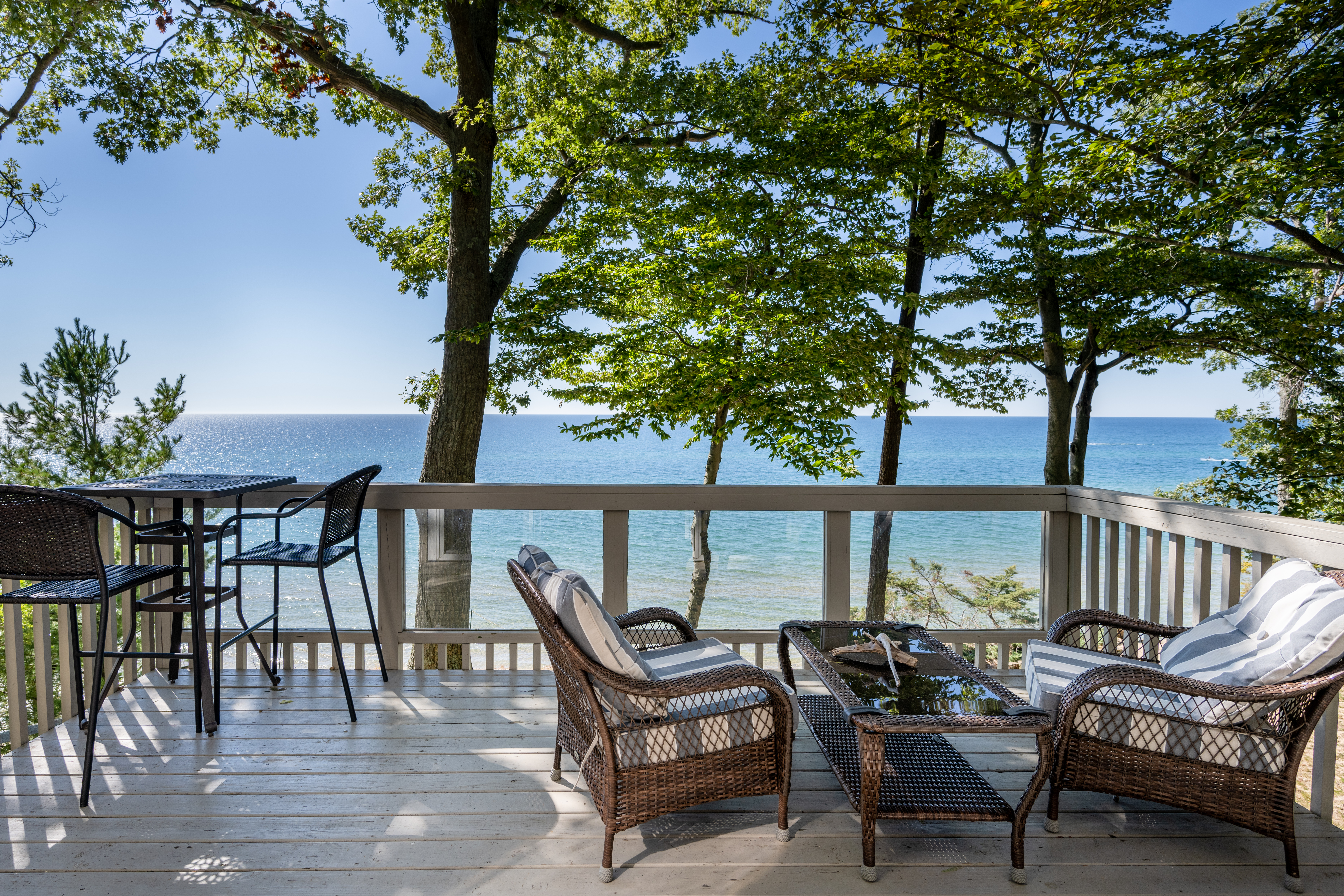 This home is the perfect vacation destination with Direct Lake Michigan access and breathtaking views!