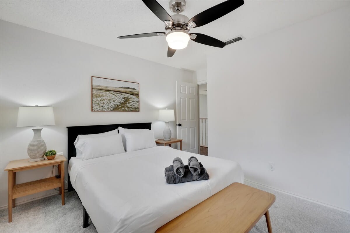 With matching bedside tables, an overhead fan, and a bedroom bench, this bedroom has been designed with your comfort in mind. With matching bedside tables, an overhead fan, and a bedroom bench, this bedroom has been designed with your comfort in mind.