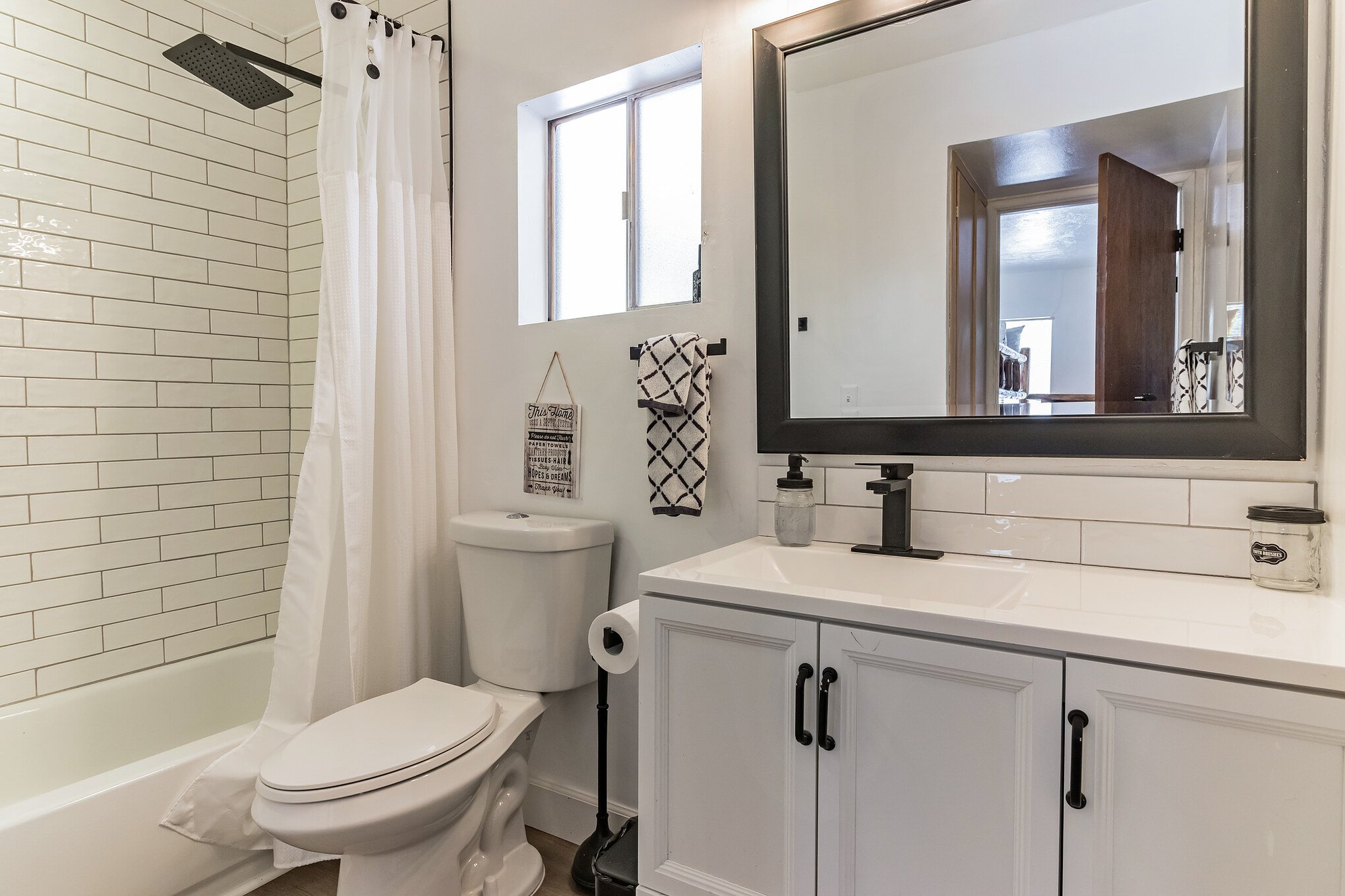 The bathroom attached to the second master suite is clean, freshly updated, and provides everything you need to be ready for a day of adventure. The rain shower head is refreshing and unique. The bathroom attached to the second master suite is clean, freshly updated, and provides everything you need to be ready for a day of adventure. The rain shower head is refreshing and unique.