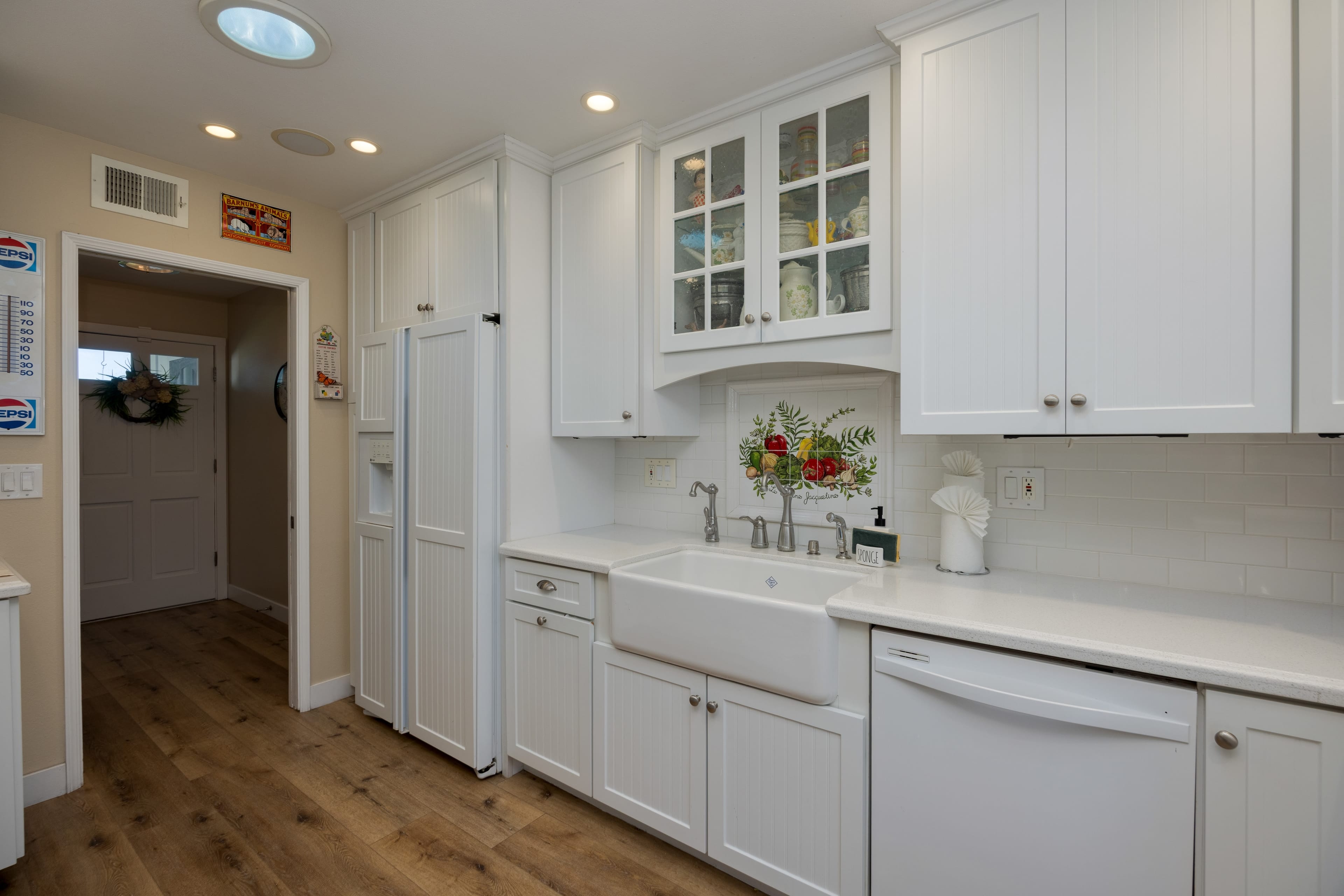Bright white kitchen with ample storage. Bright white kitchen with ample storage.